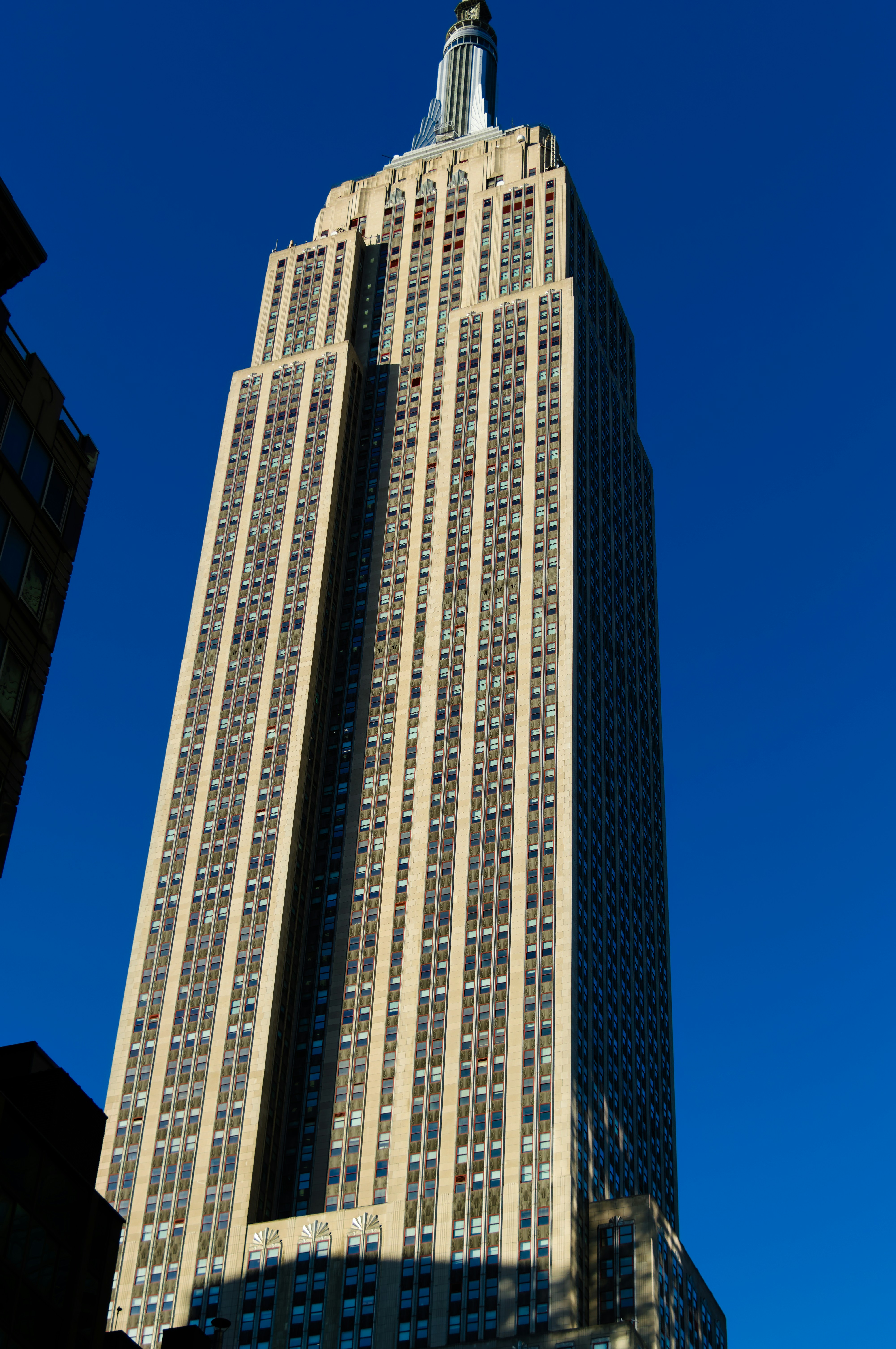 Empire state building against a clear blue sky