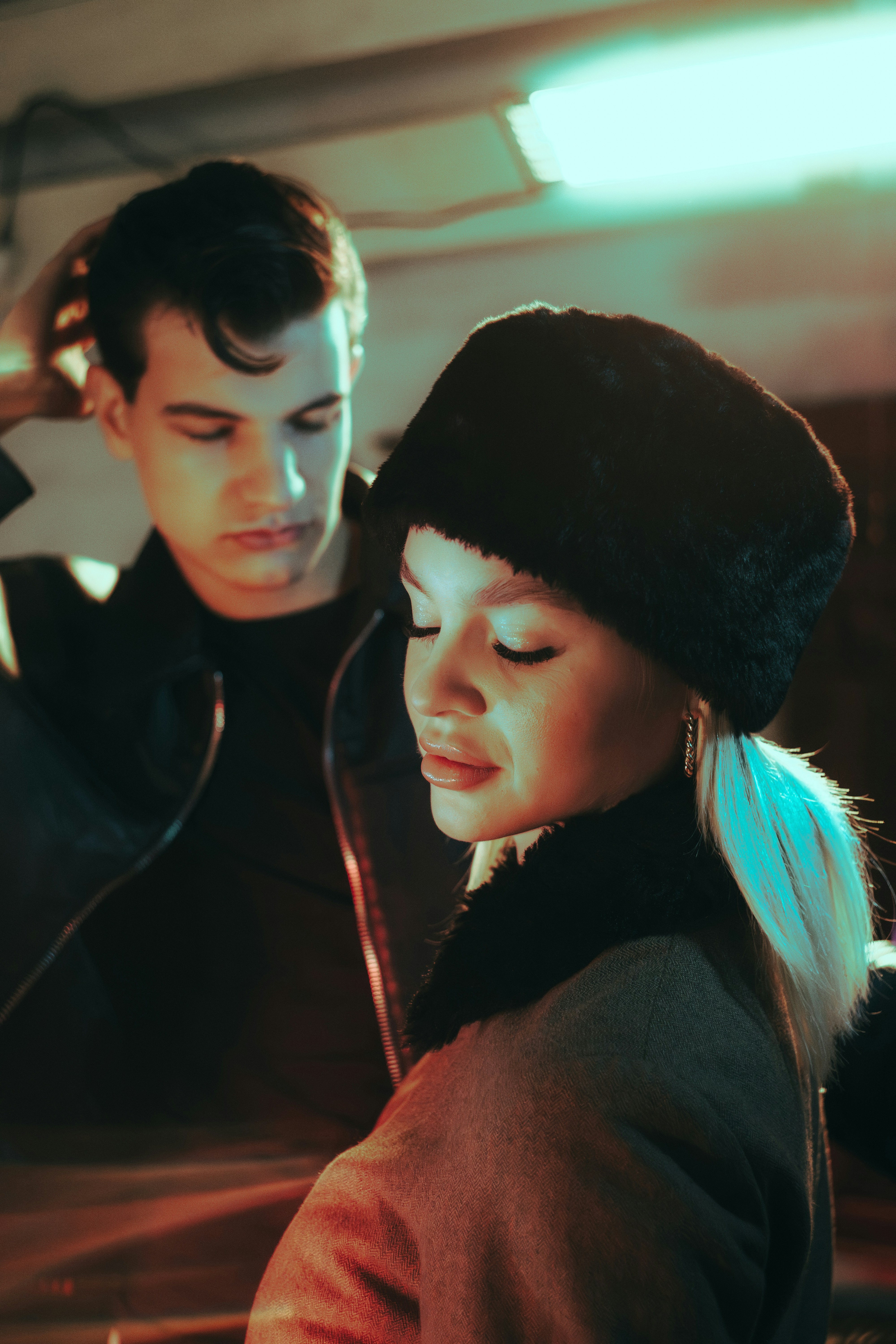 Couple in warm winter clothes with dramatic lighting