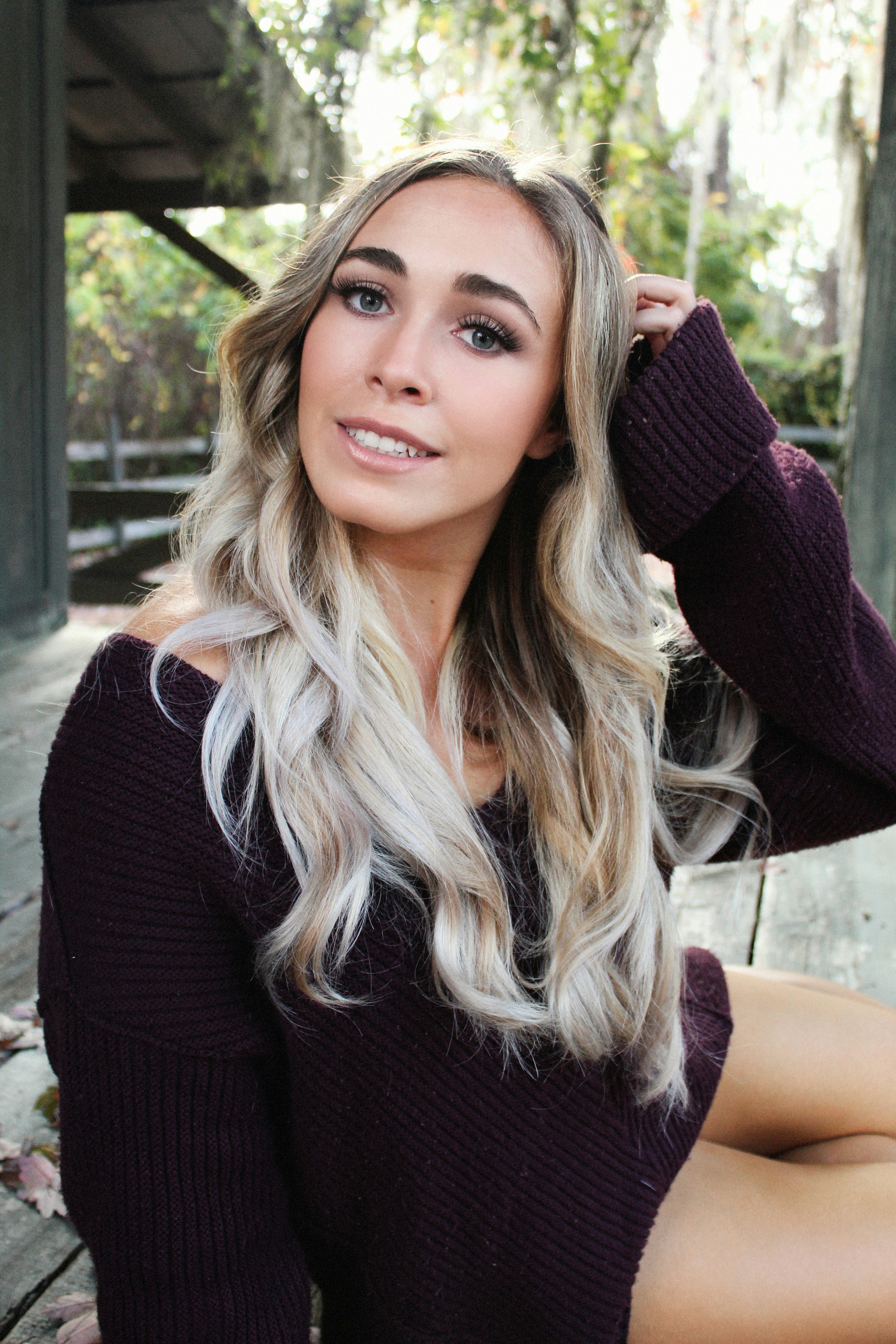 Client discussing balayage vs highlights with professional colorist before hair appointment
