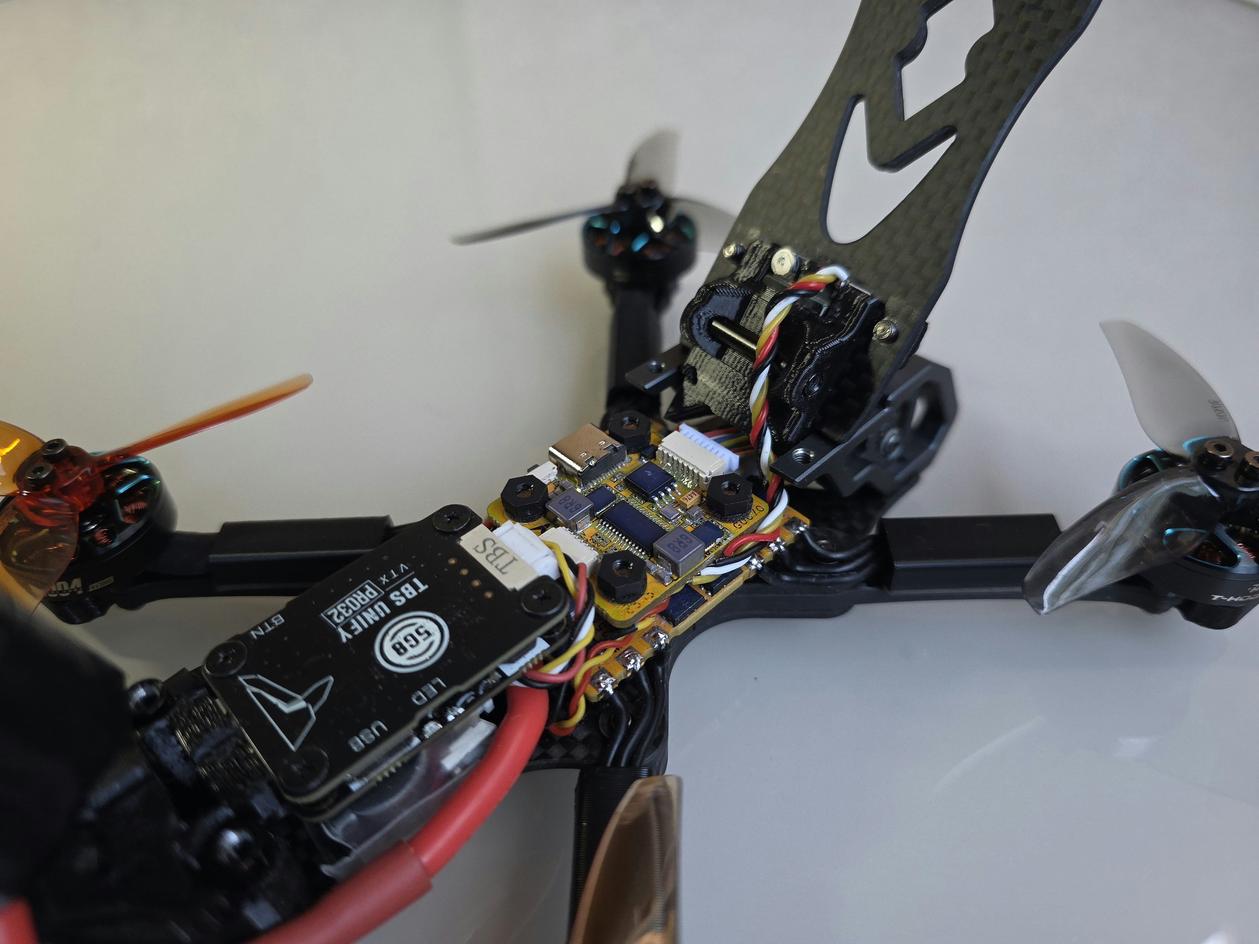 Close-up of a drone's internal electronics and propellers.