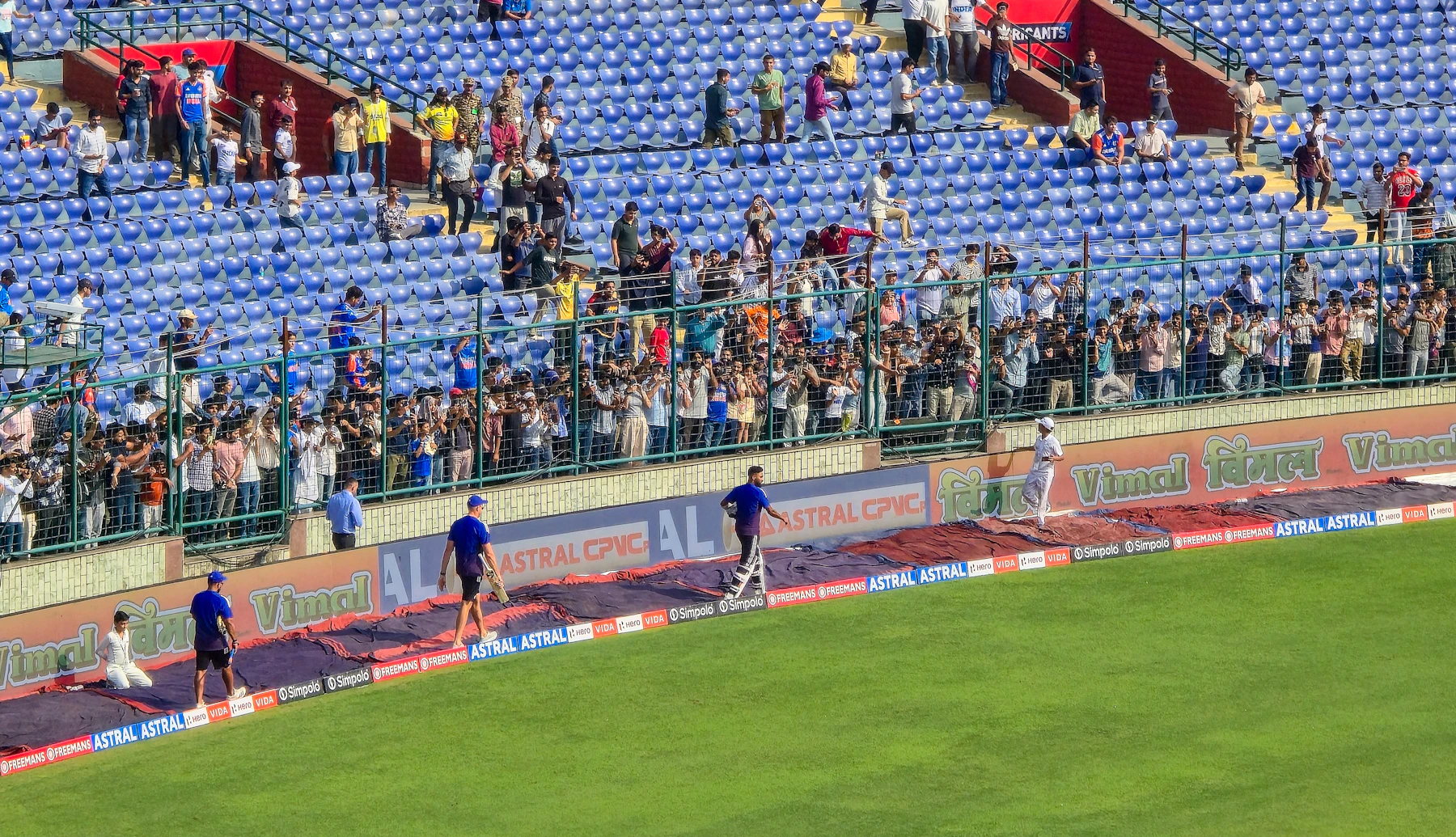 Spectators watching the action from stadium seats