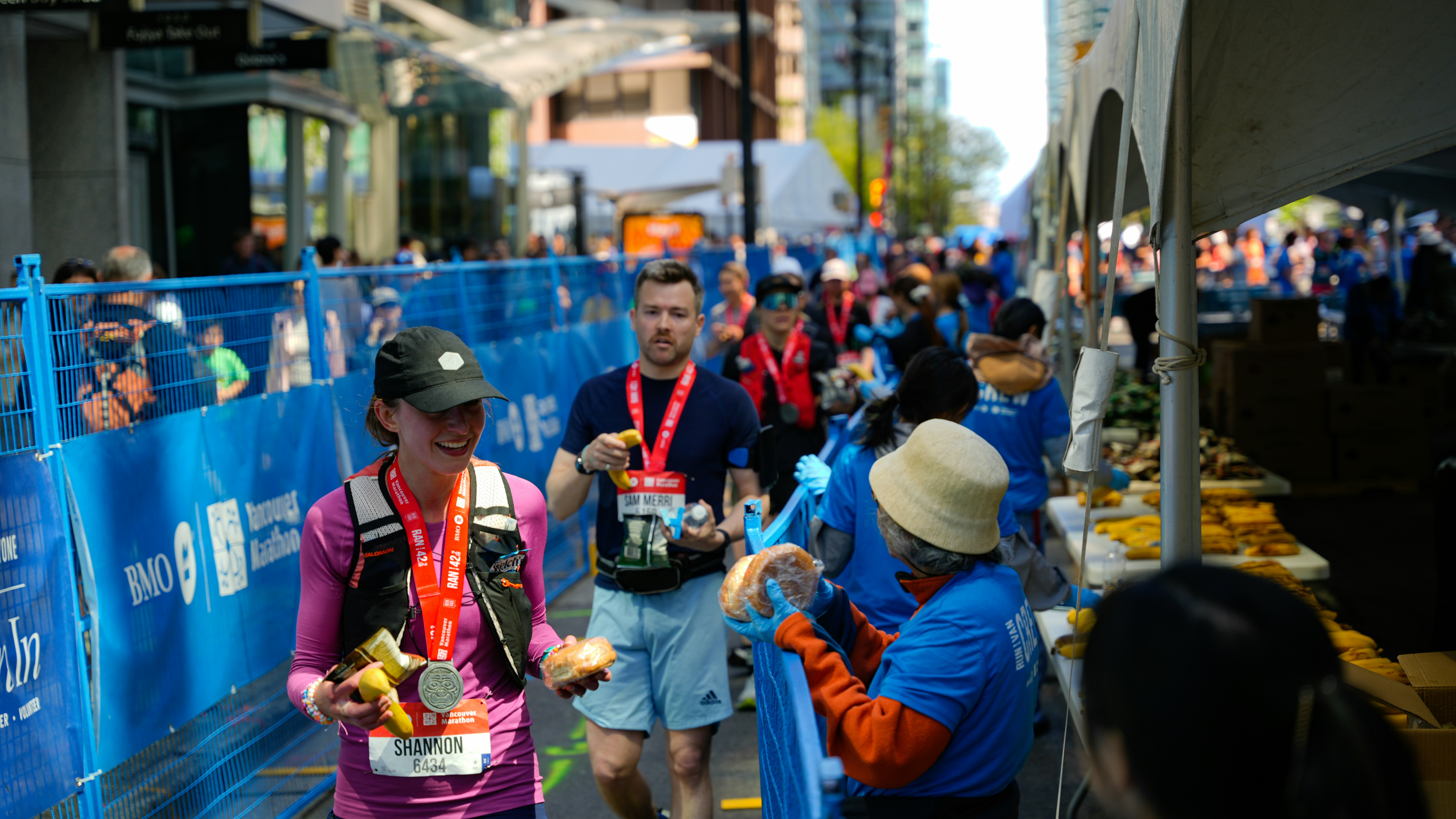 Runners receive refreshments after a race event