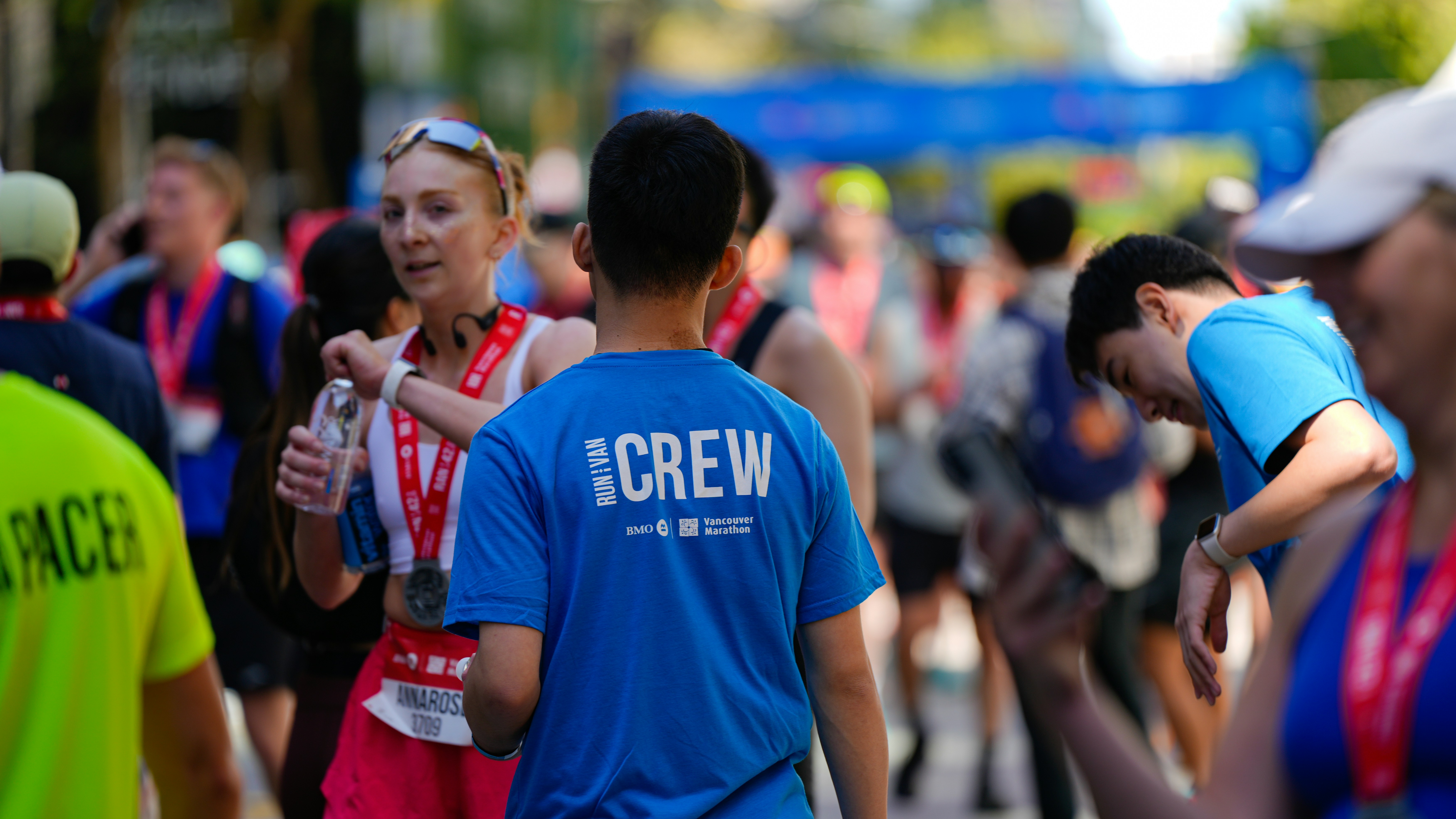 Runners and crew at a race finish line