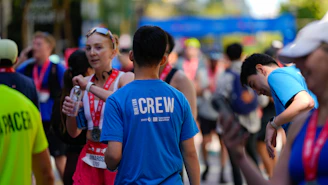 Runners and crew at a race finish line