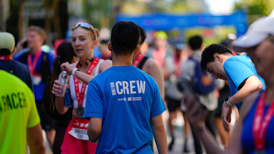 Runners and crew at a race finish line