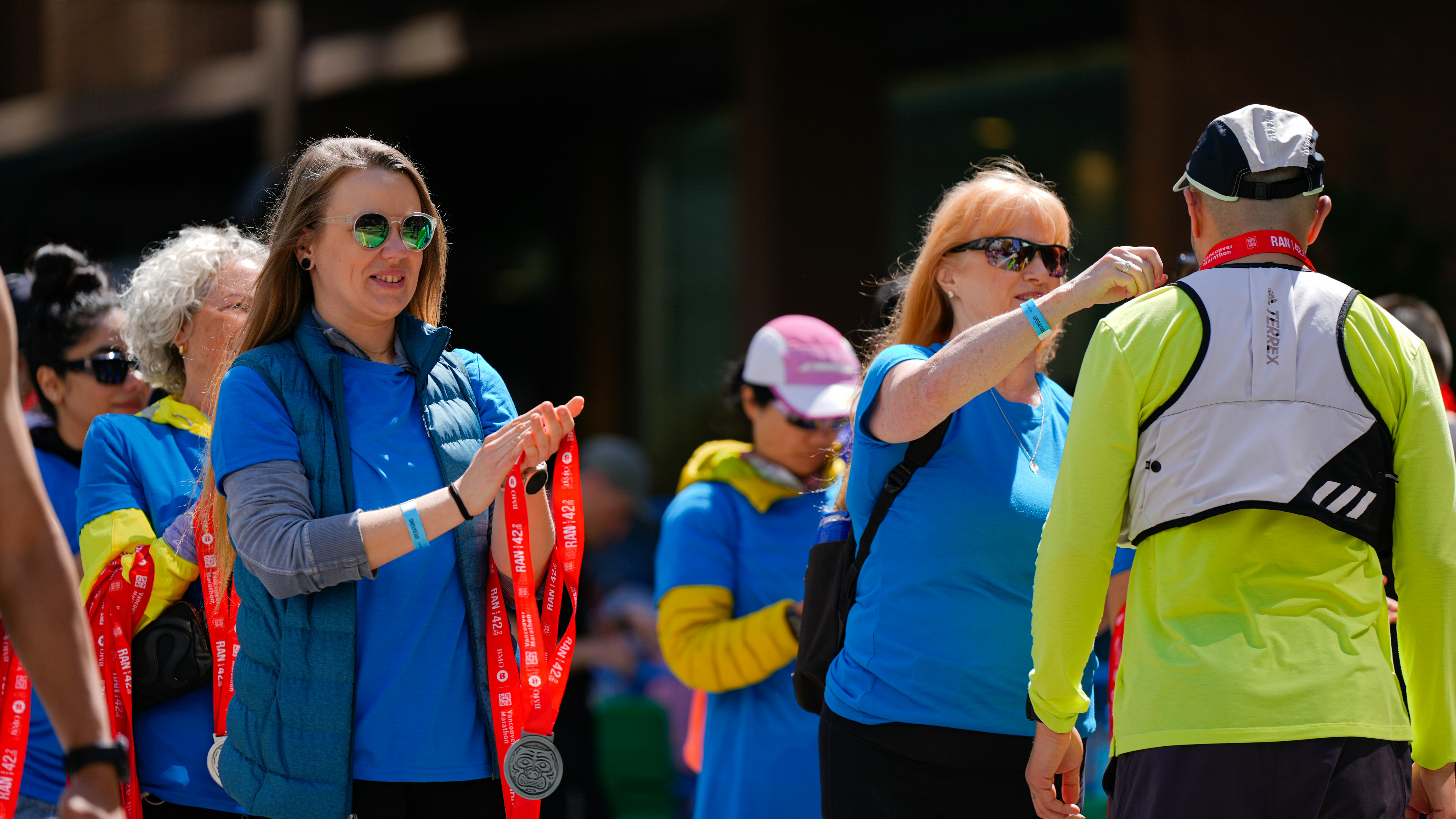 Runners receiving medals after a race