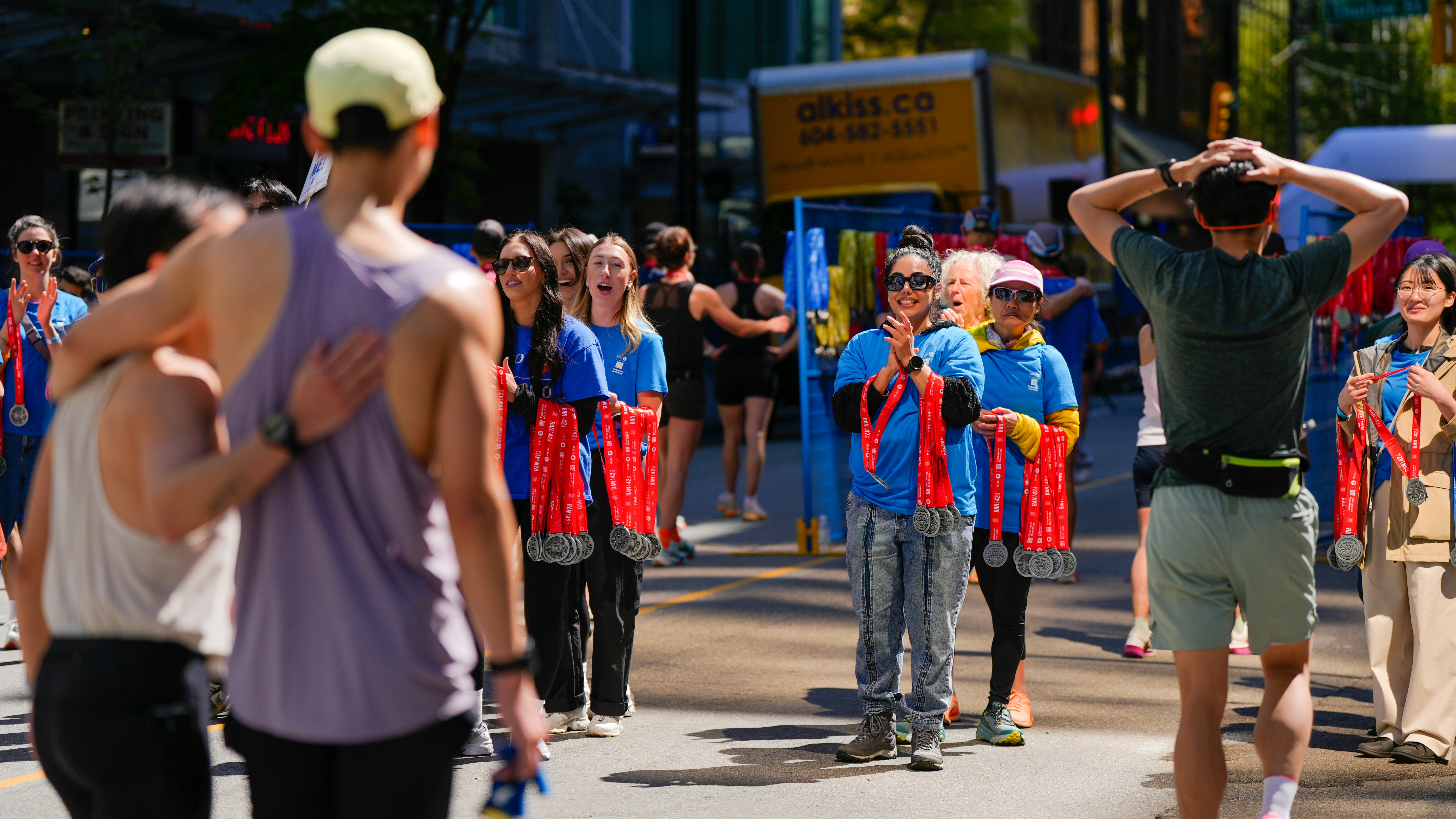 Runners celebrate with medals after a race