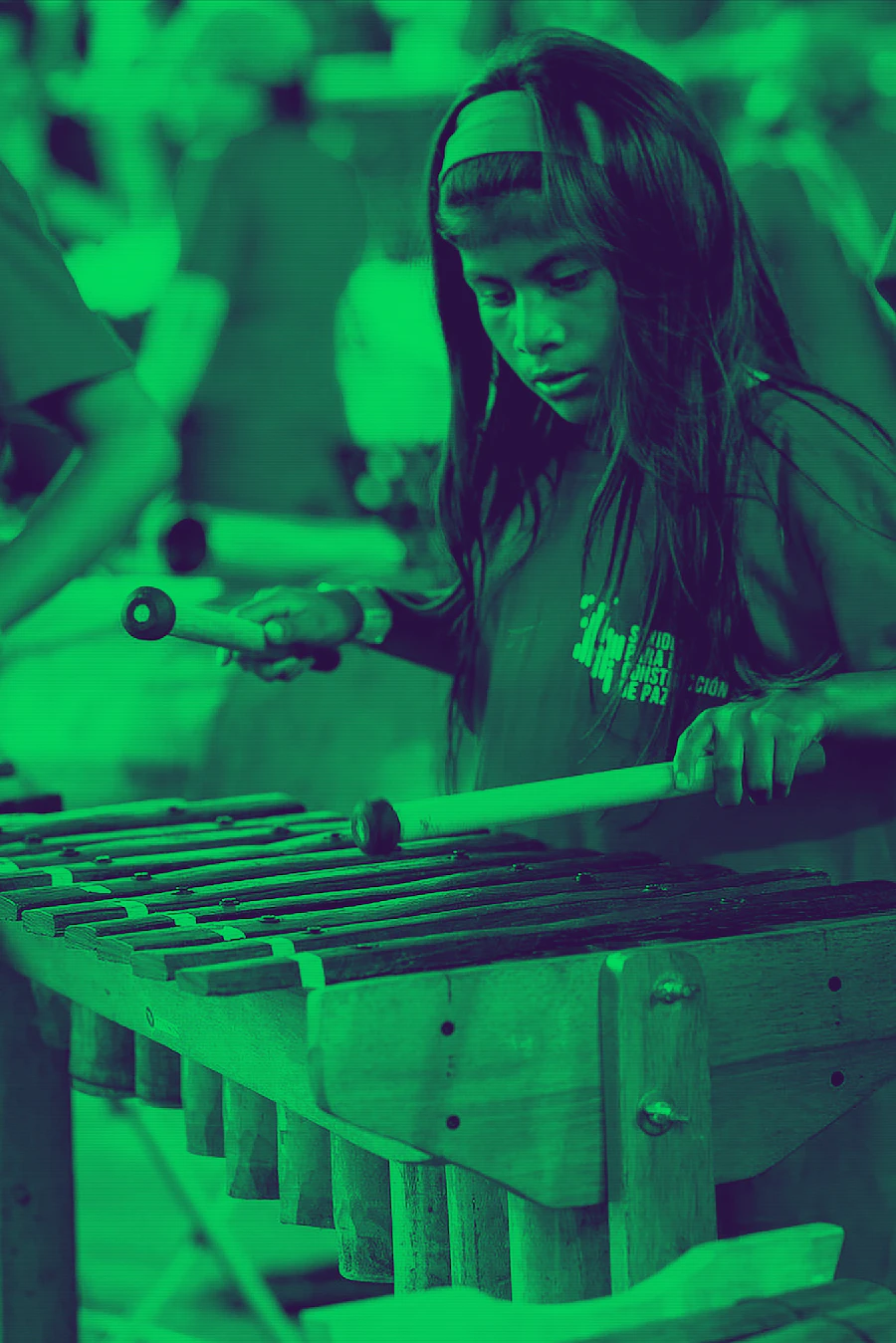 Children playing mridanga and karatalas while singing kirtan