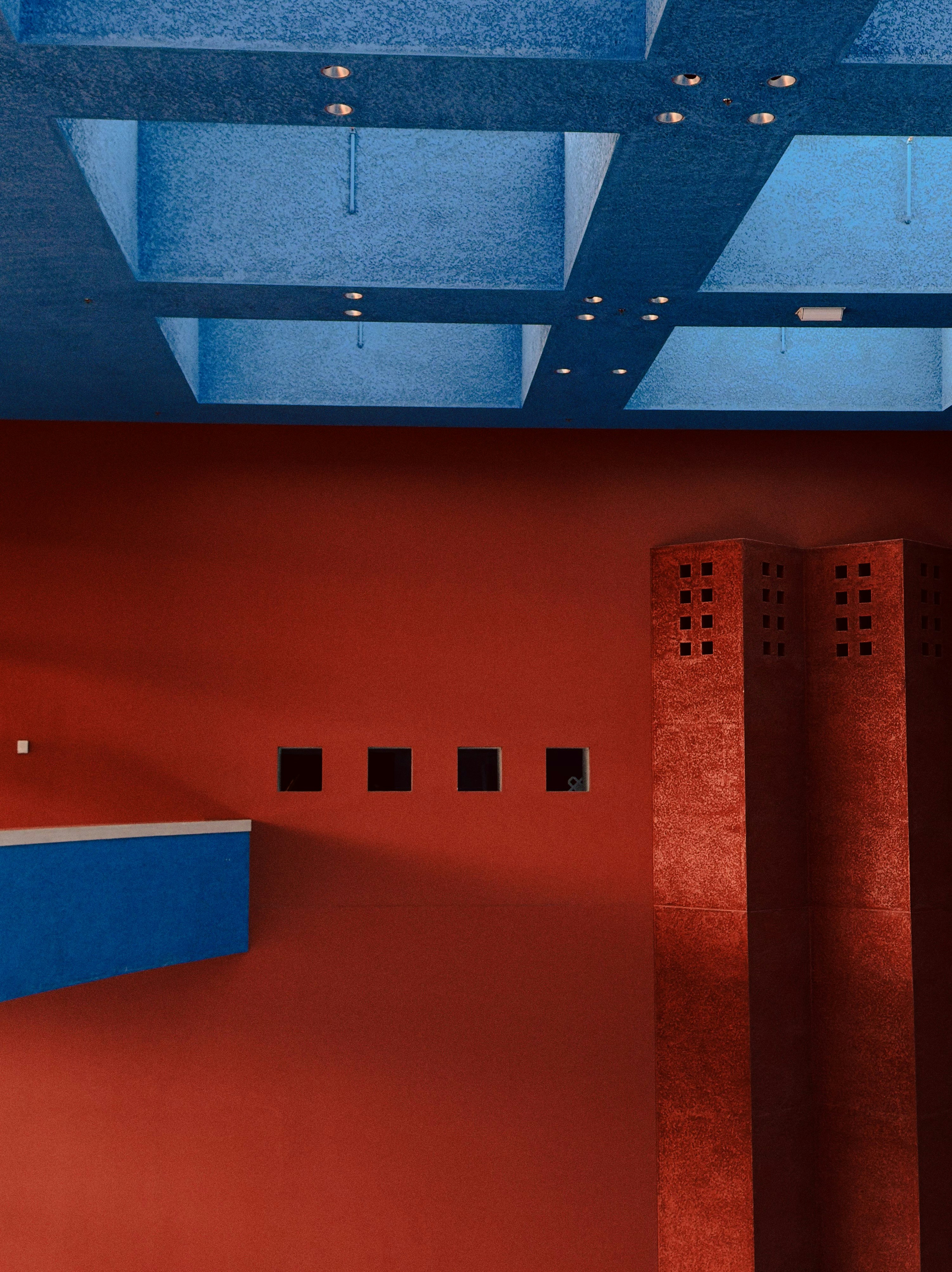 Red wall with blue ceiling and red pillar