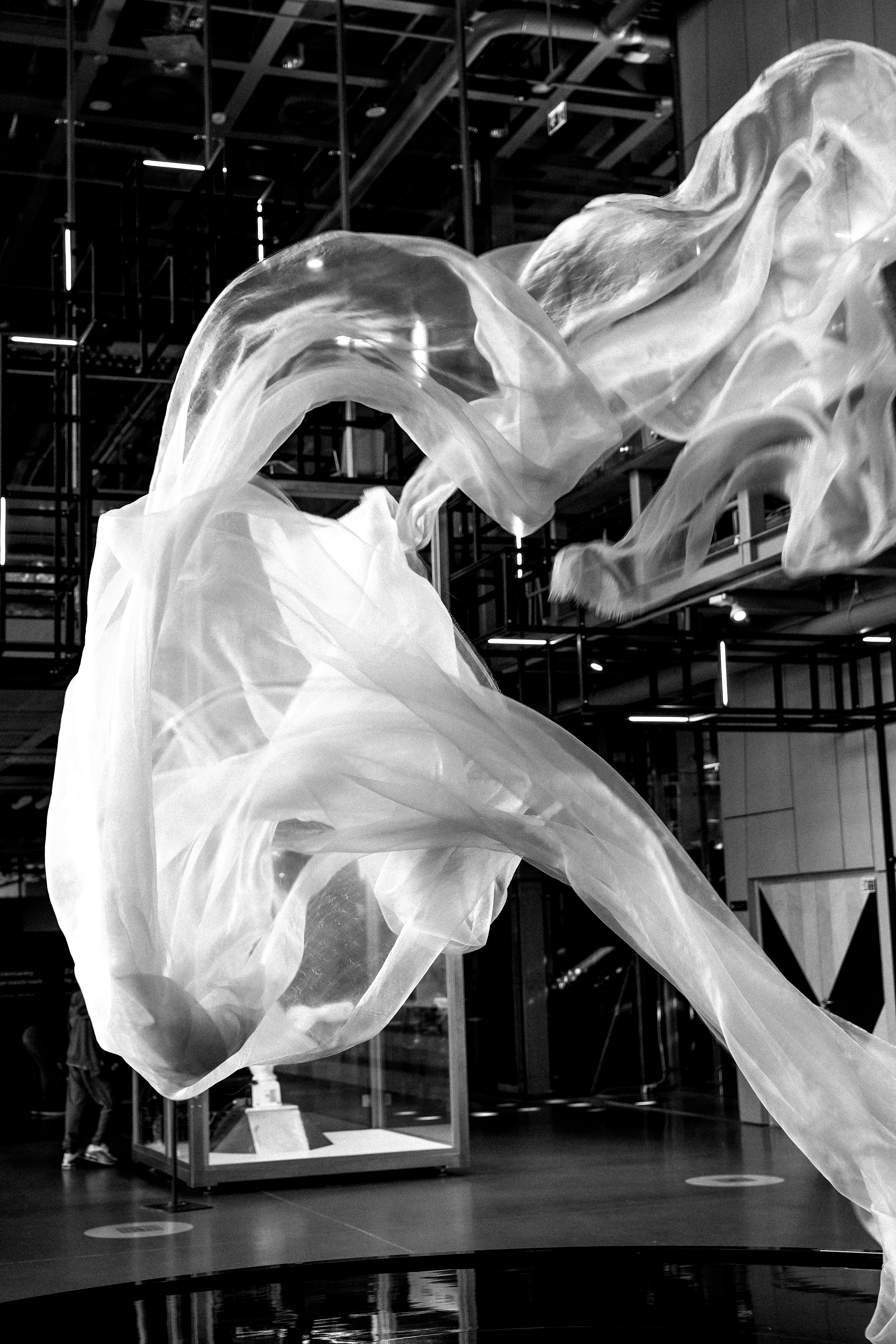 White fabric flowing in an indoor space