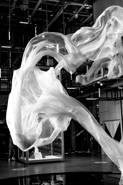 White fabric flowing in an indoor space