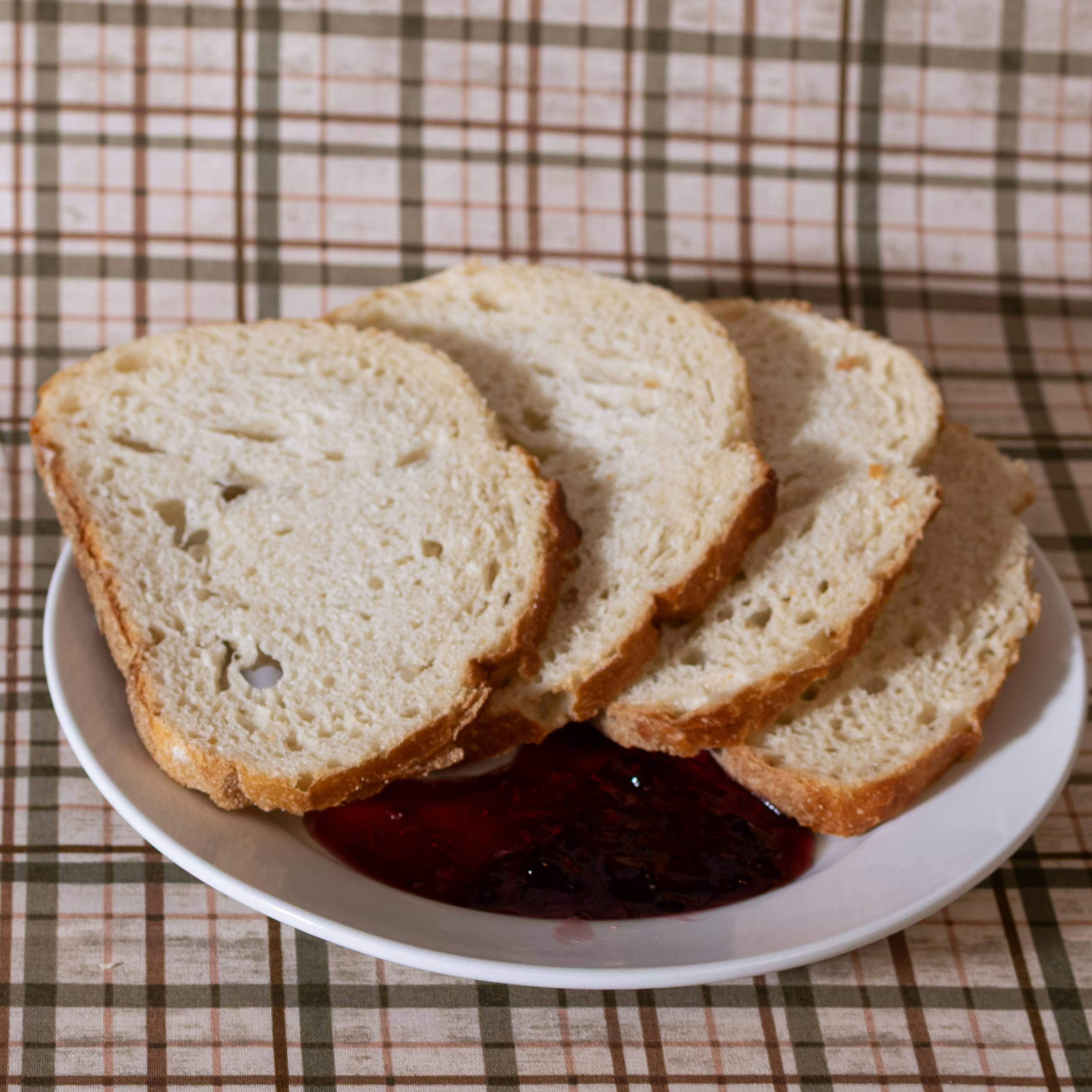 Slices of bread with jam on a plate