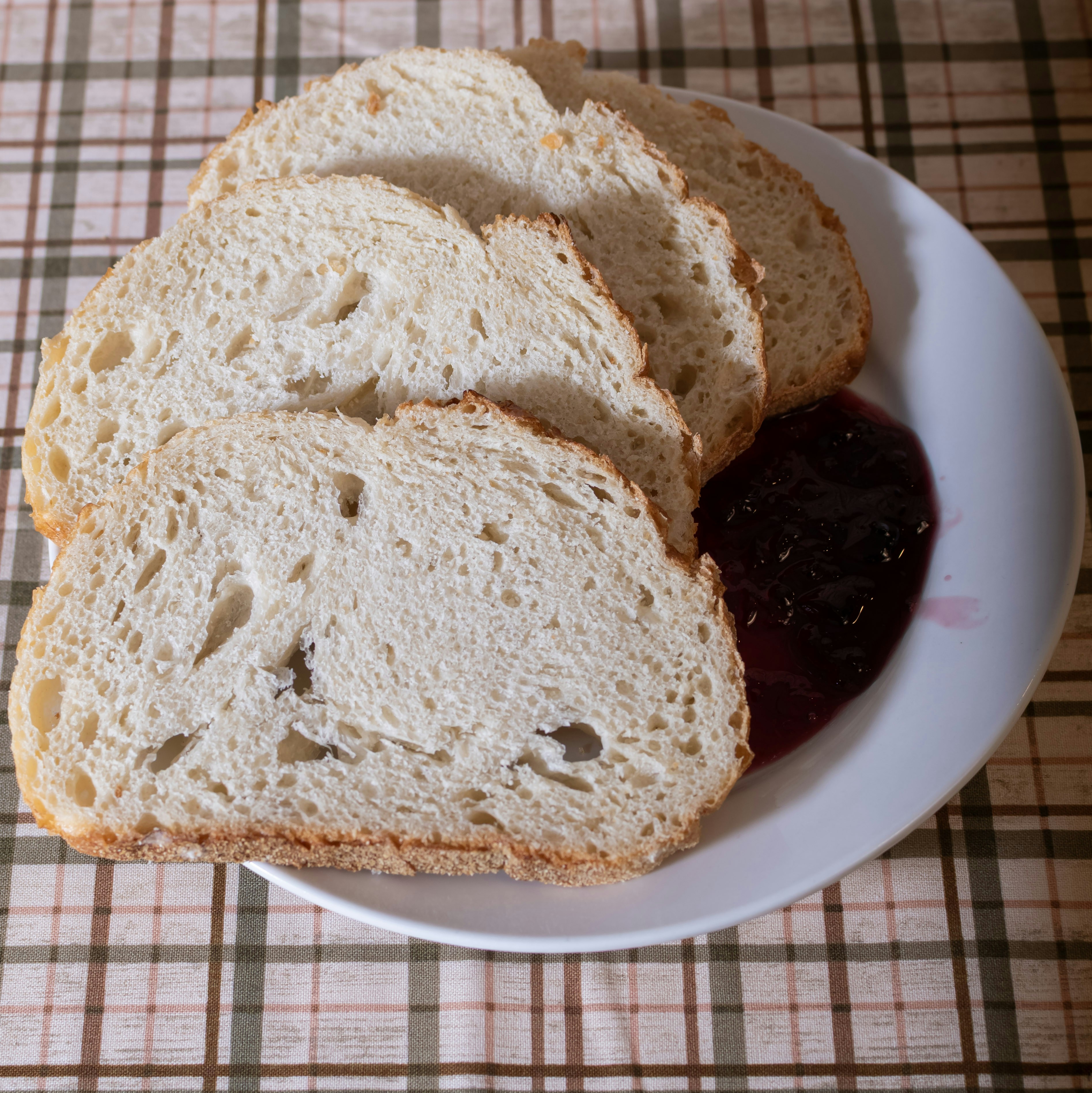 Slices of bread with jam on a plate