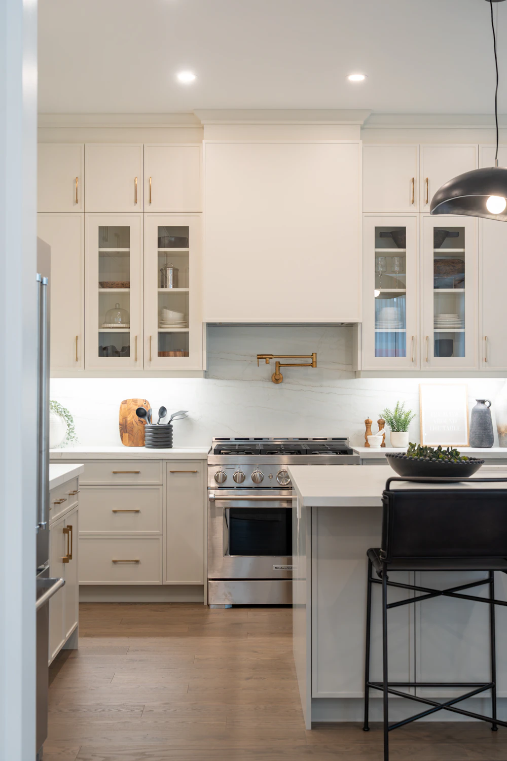Modern kitchen cabinetry surrounding stainless steel appliances, shown as design inspiration