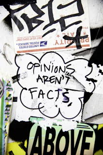 Cloud sticker with text "opinions aren't facts".