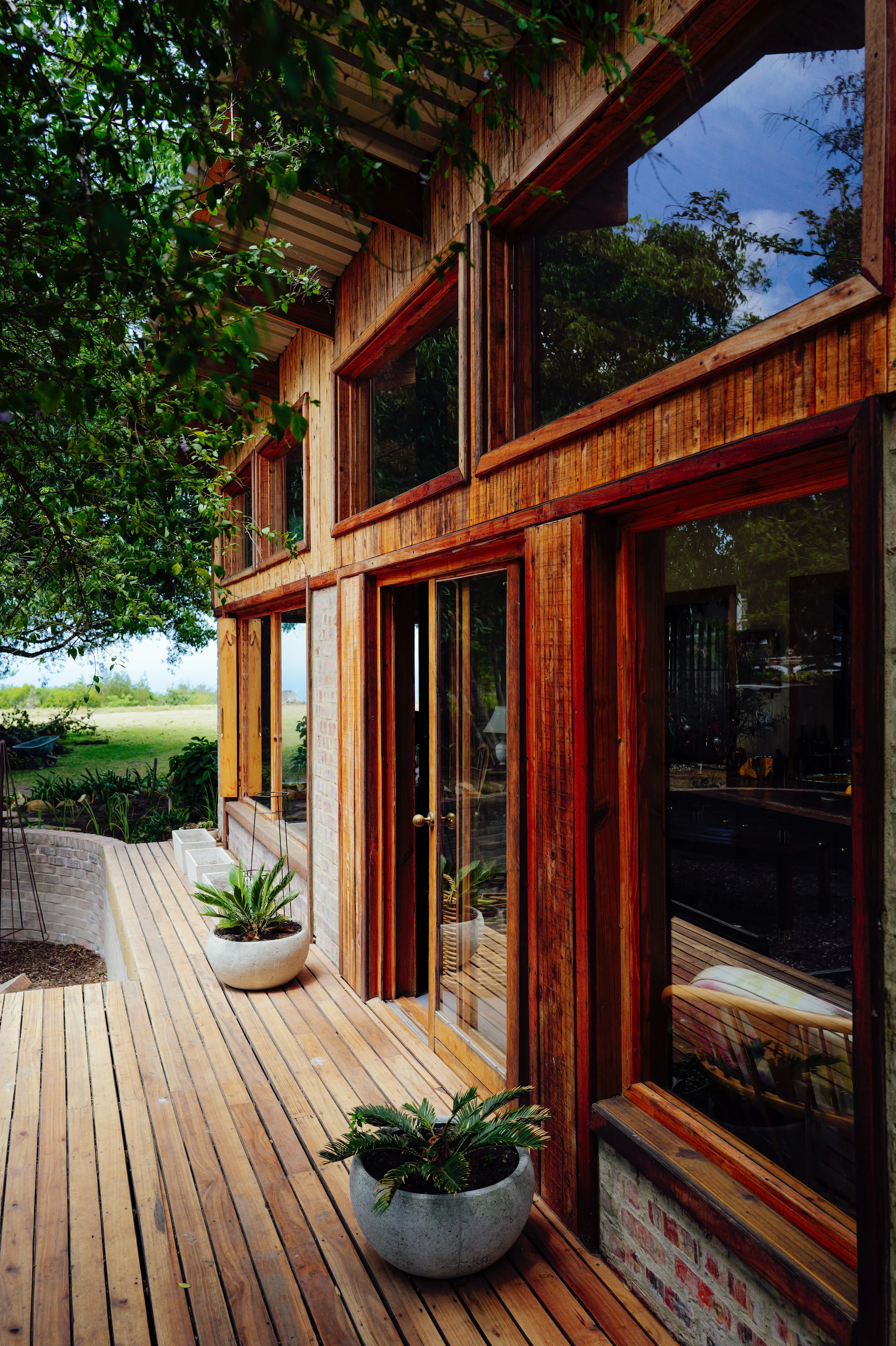 Modern wooden house with large windows and deck