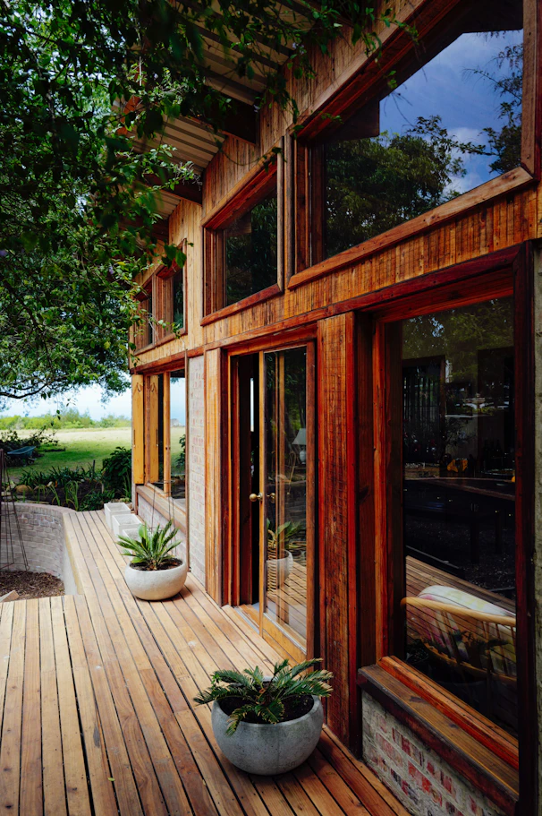 Modern wooden house with large windows and deck