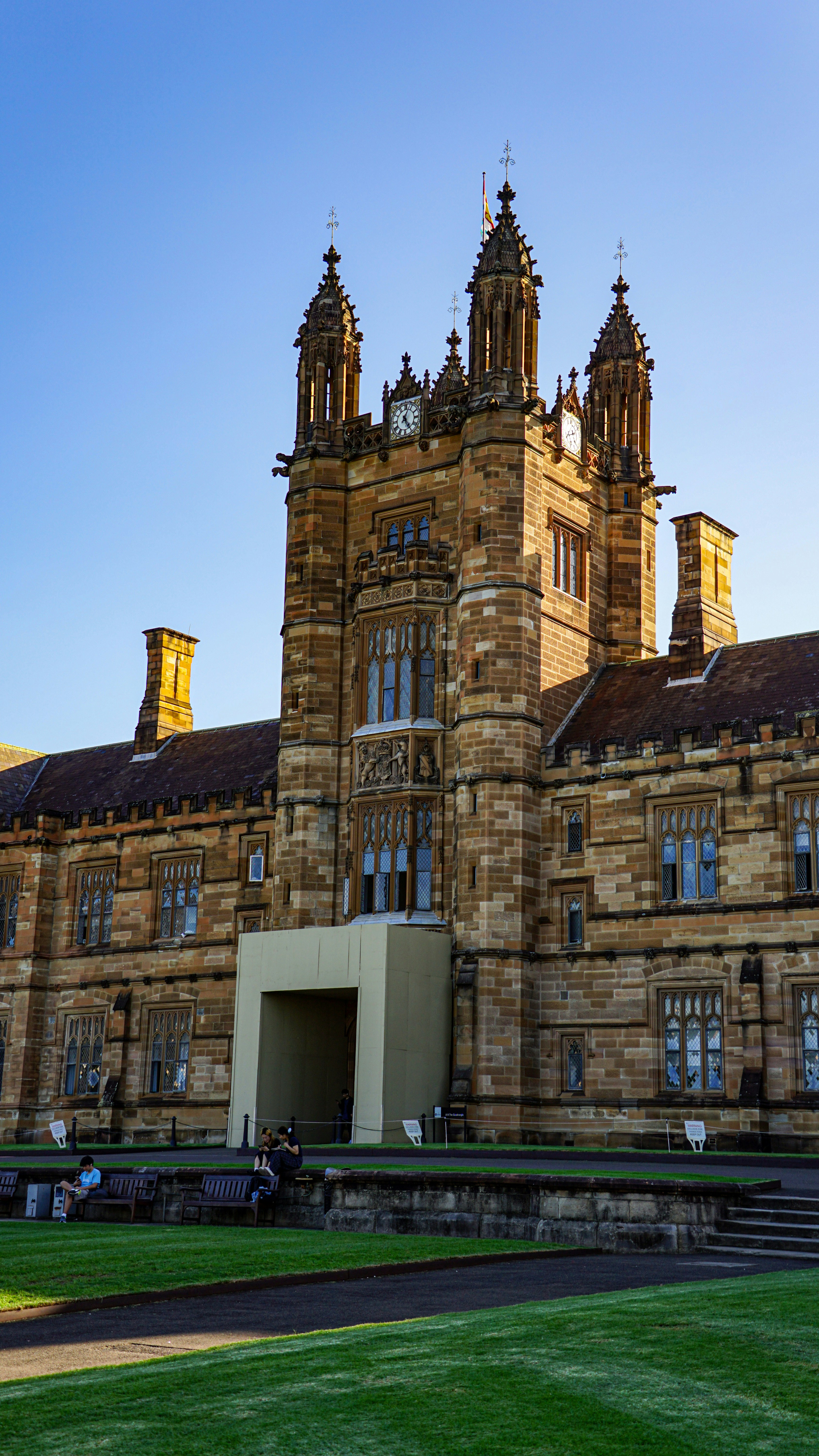 Historic stone building with ornate towers under a clear sky photo ...