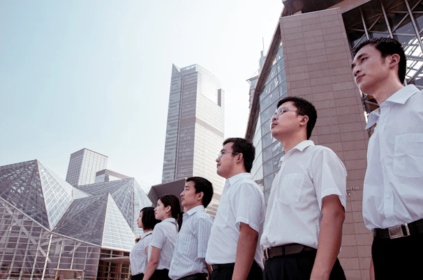 Group of business people standing in a line outdoors