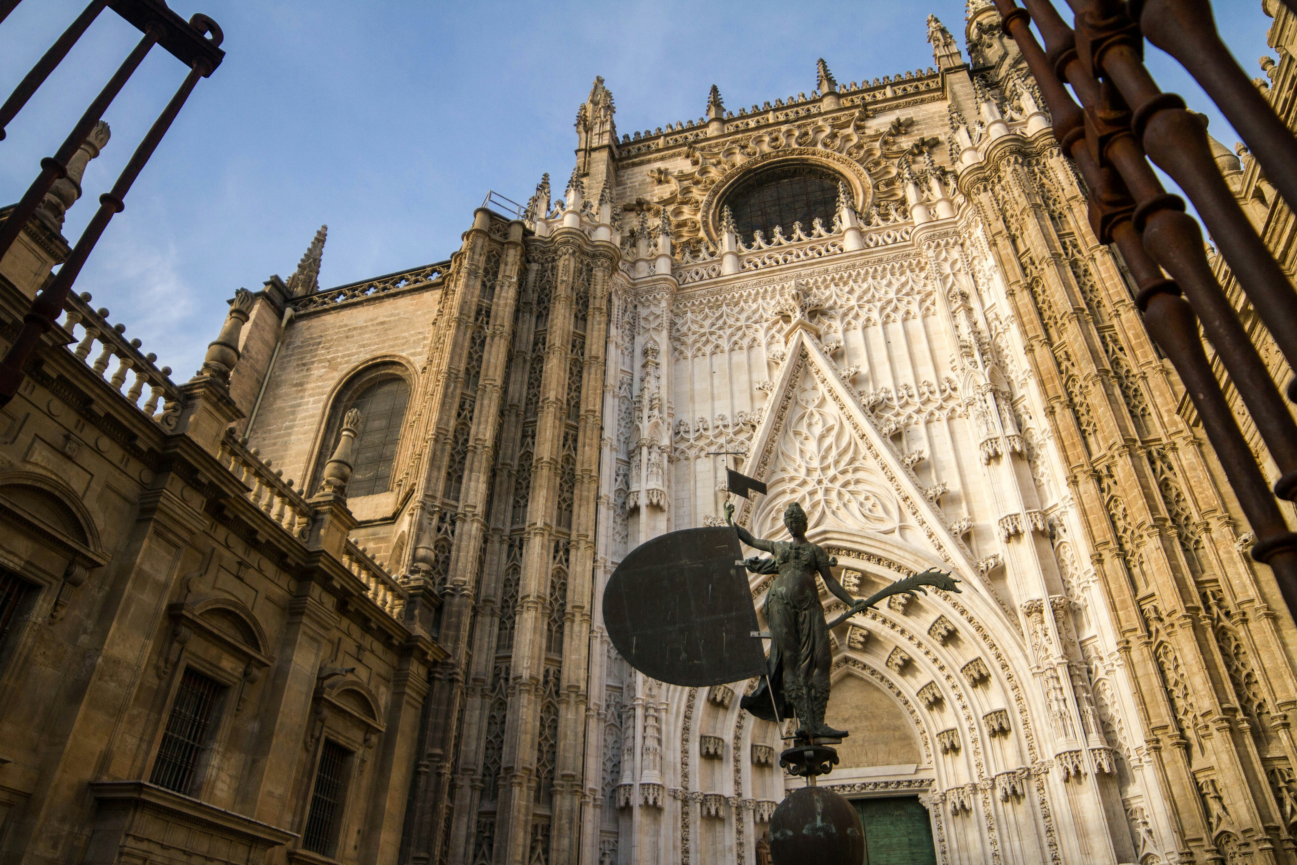 The ornate facade of Seville Cathedral and the Giralda