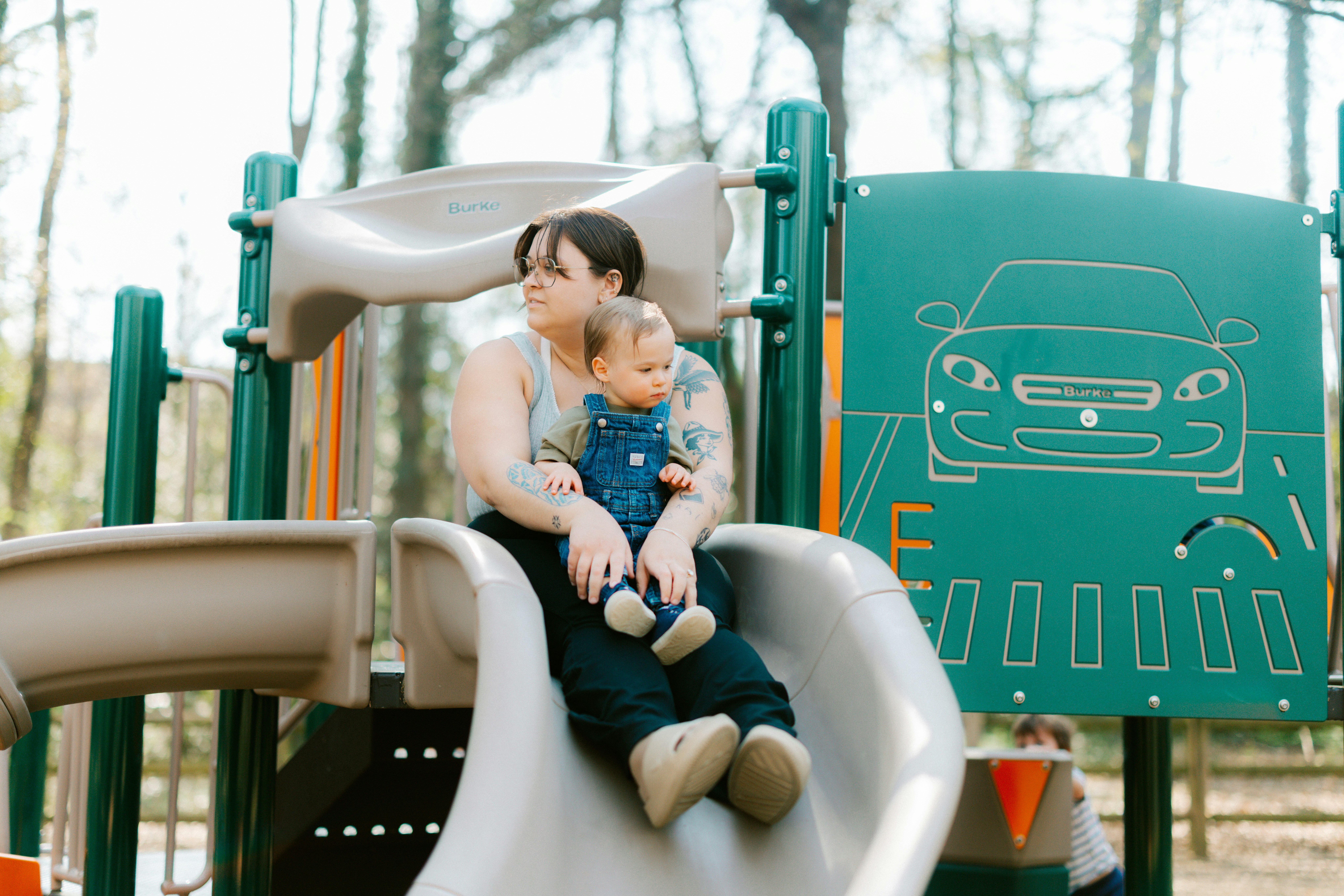 Mother and child on a playground slide
