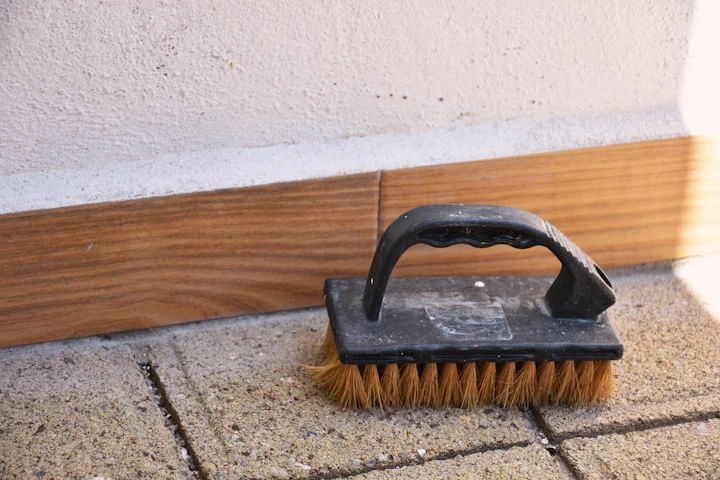 Cleaning and preparation tools used on an outdoor concrete surface