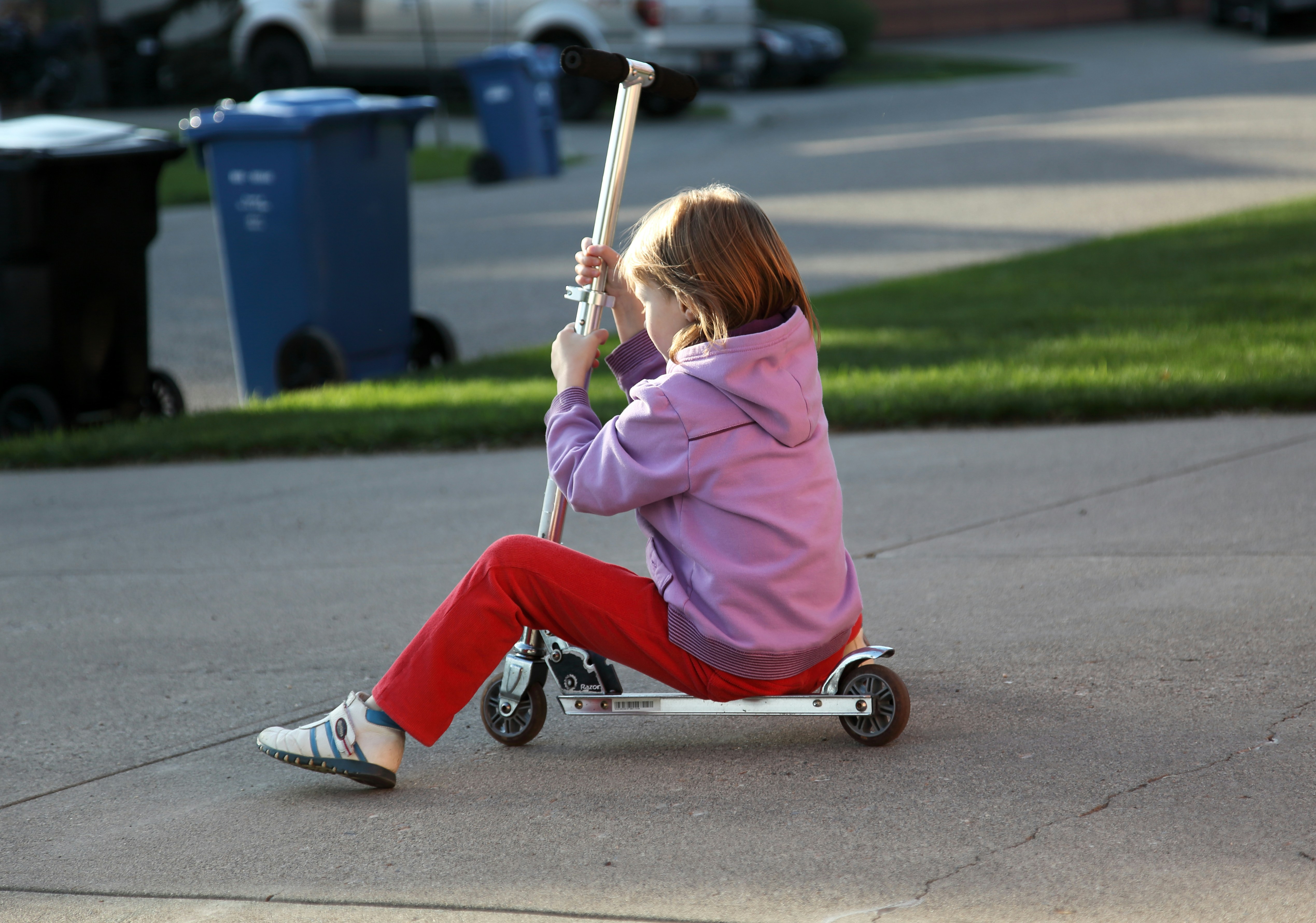 children playing safely in a suburban Maryland driveway - how auto reverse protects your family