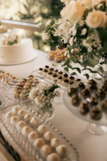 Dessert table with cake, cookies, and chocolates