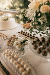 Dessert table with cake, cookies, and chocolates