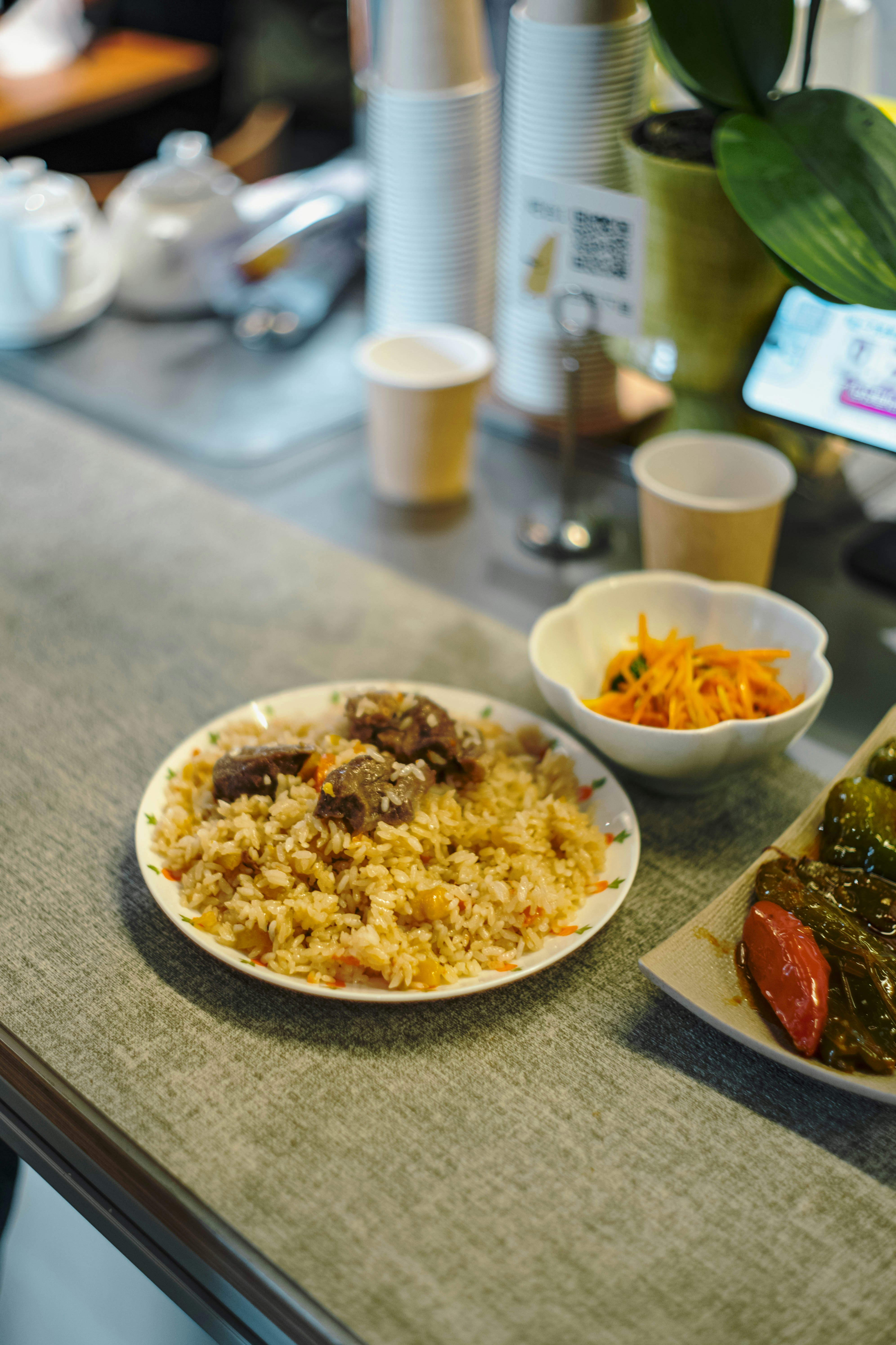 Plate of pilaf with meat and side salad