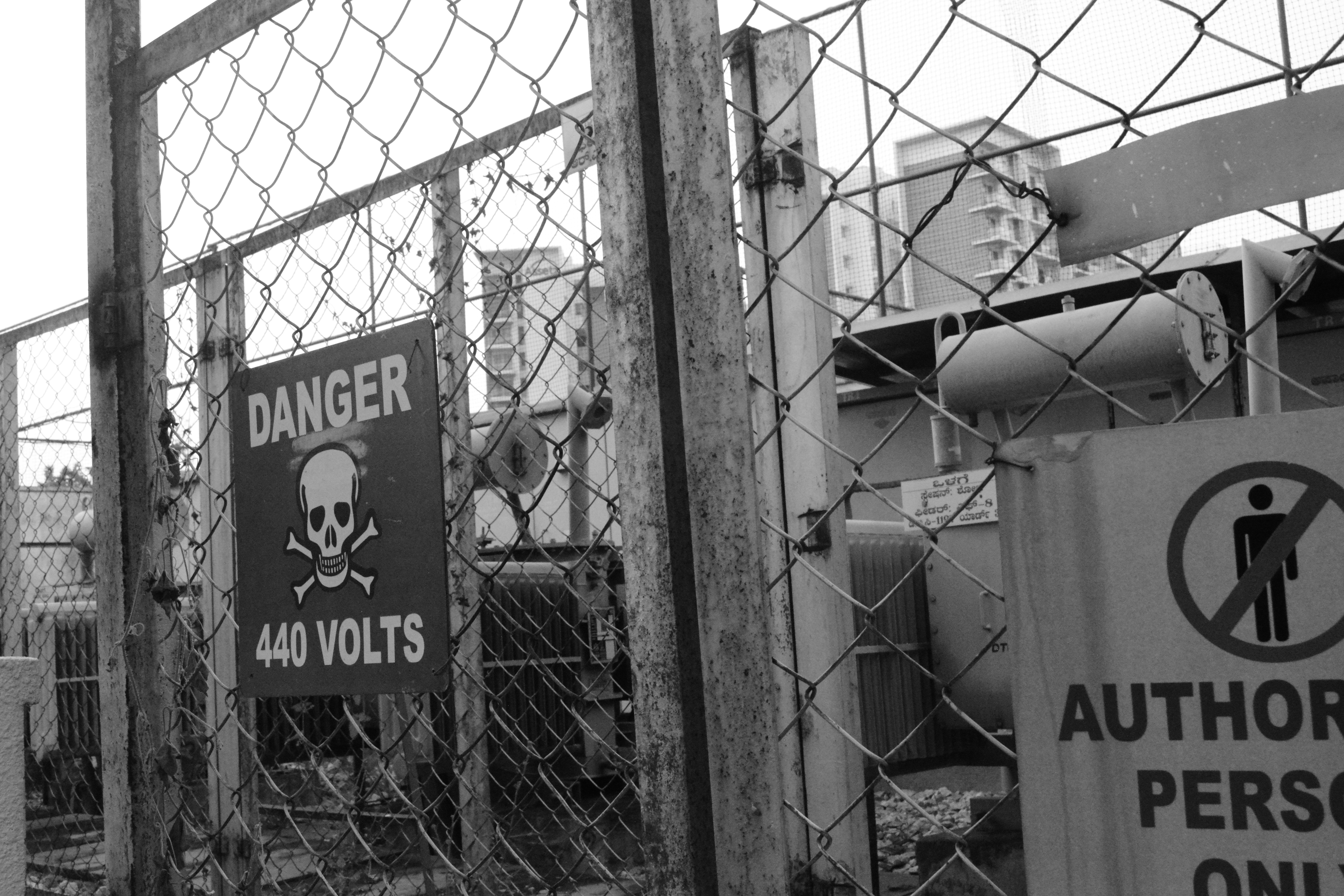 Danger 440 volts sign on fence (Photo by Annie Agarwal on Unsplash)