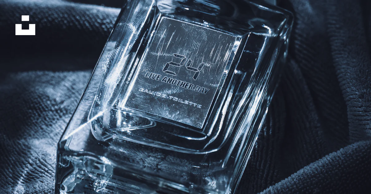 Clear glass perfume bottle with silver cap on velvet photo – Free Dark ...