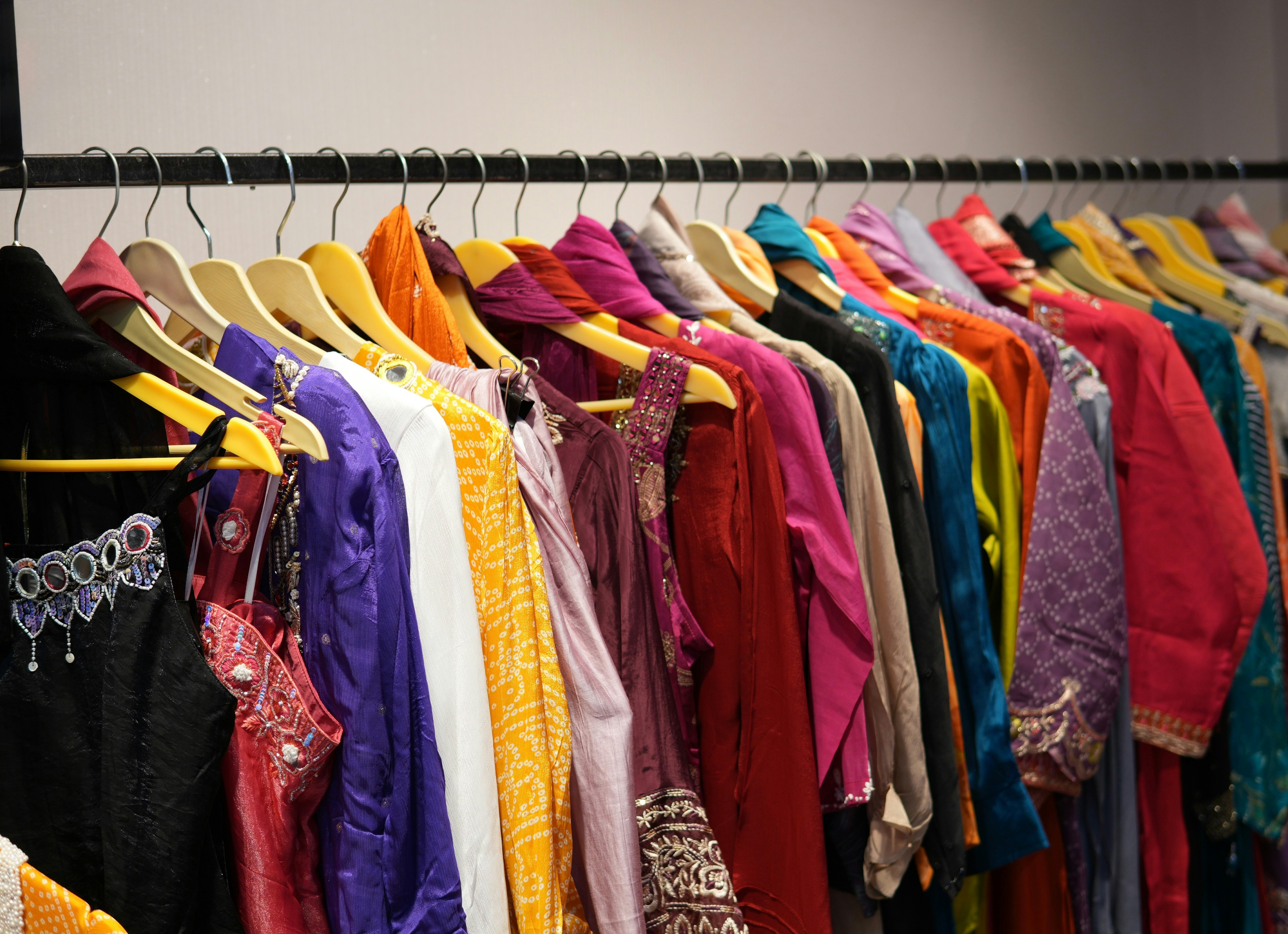 Colorful clothes hanging on a rack