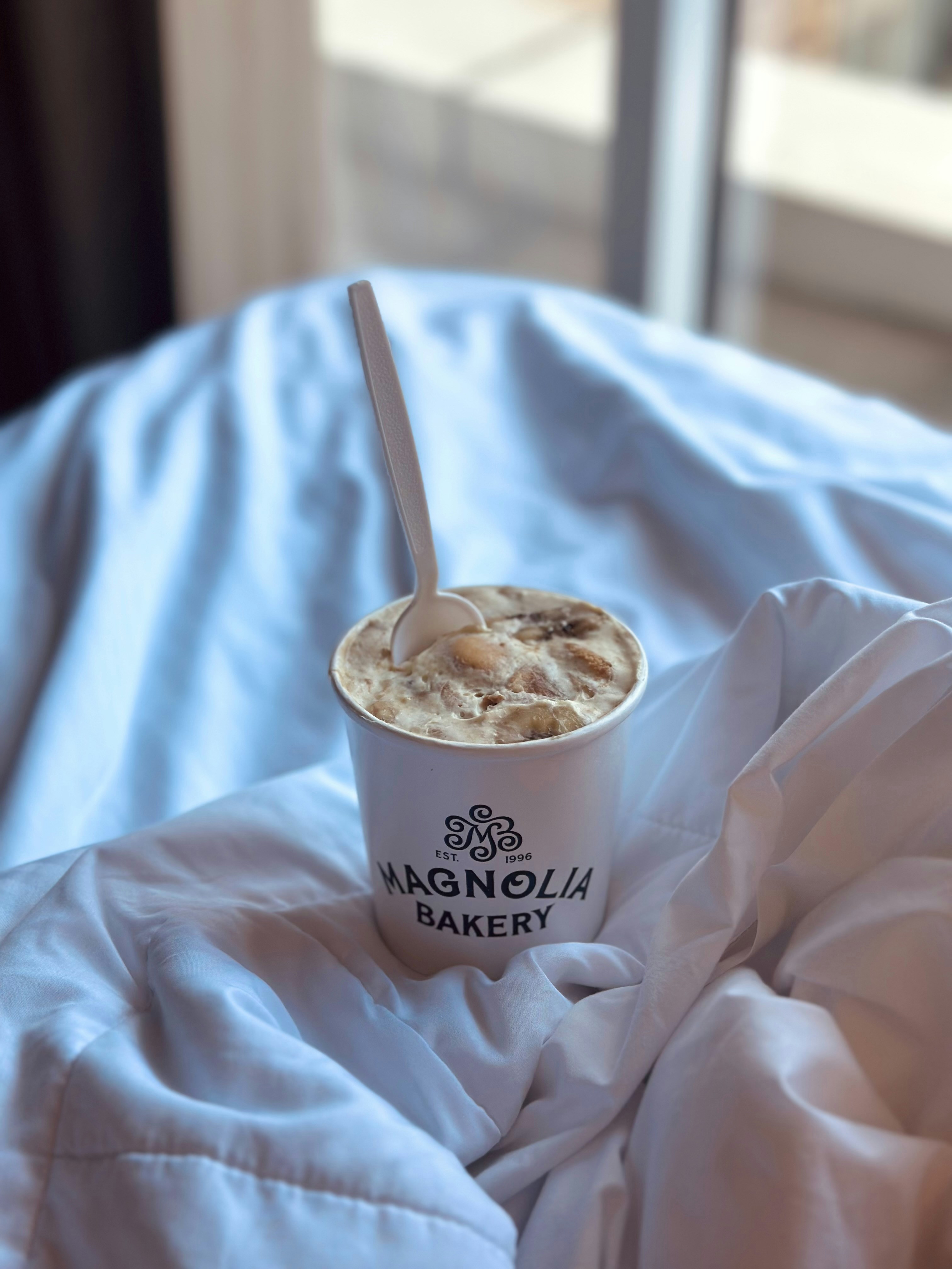 Magnolia bakery dessert in a cup with spoon.