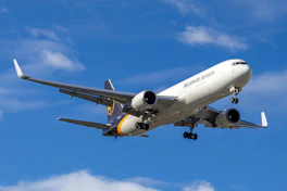 A large cargo plane flying in the sky