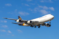 A large cargo airplane flying in the sky.