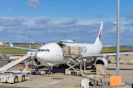 Cargo plane being loaded at an airport tarmac