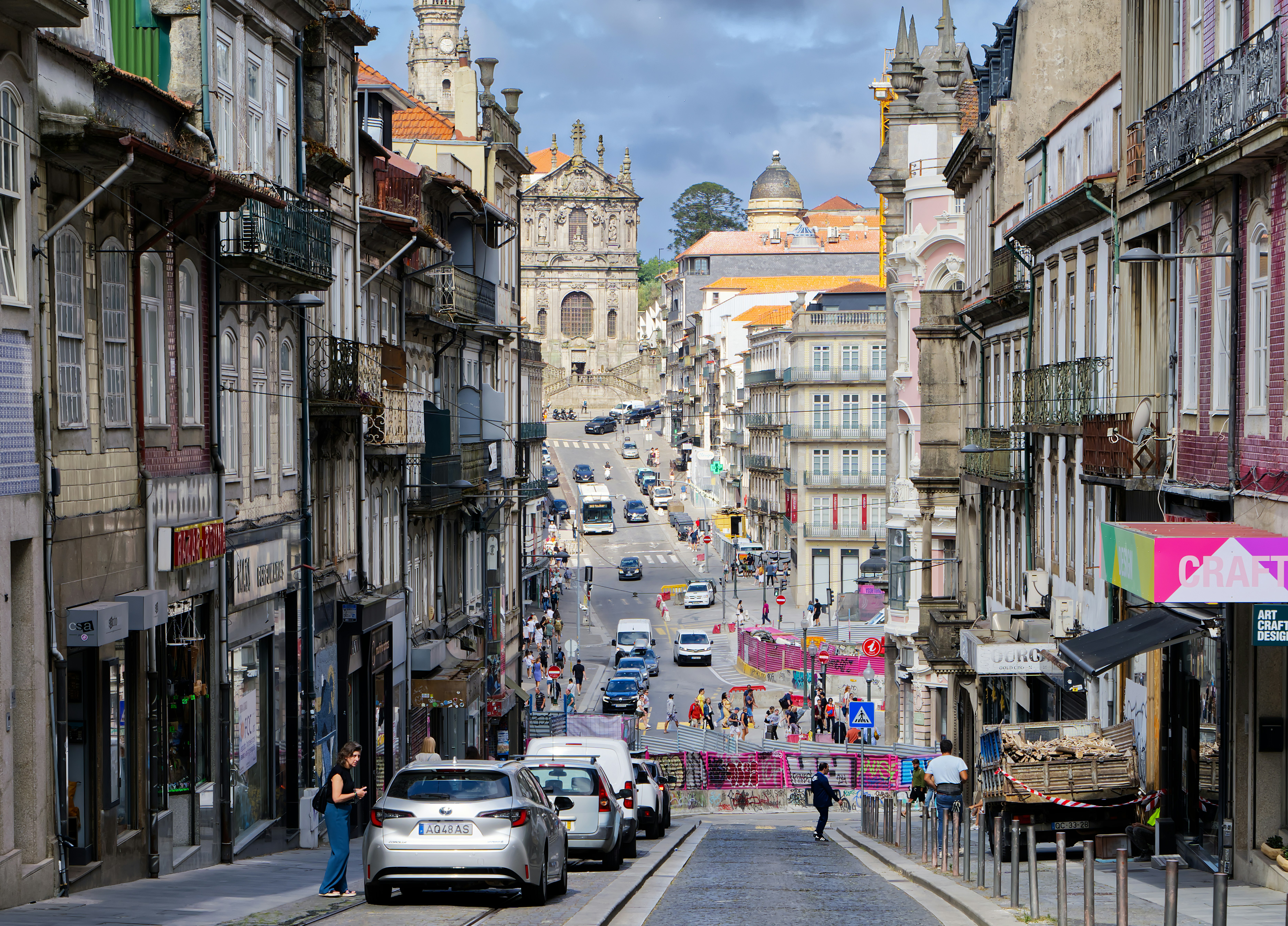 A busy street in a european city with historic buildings.