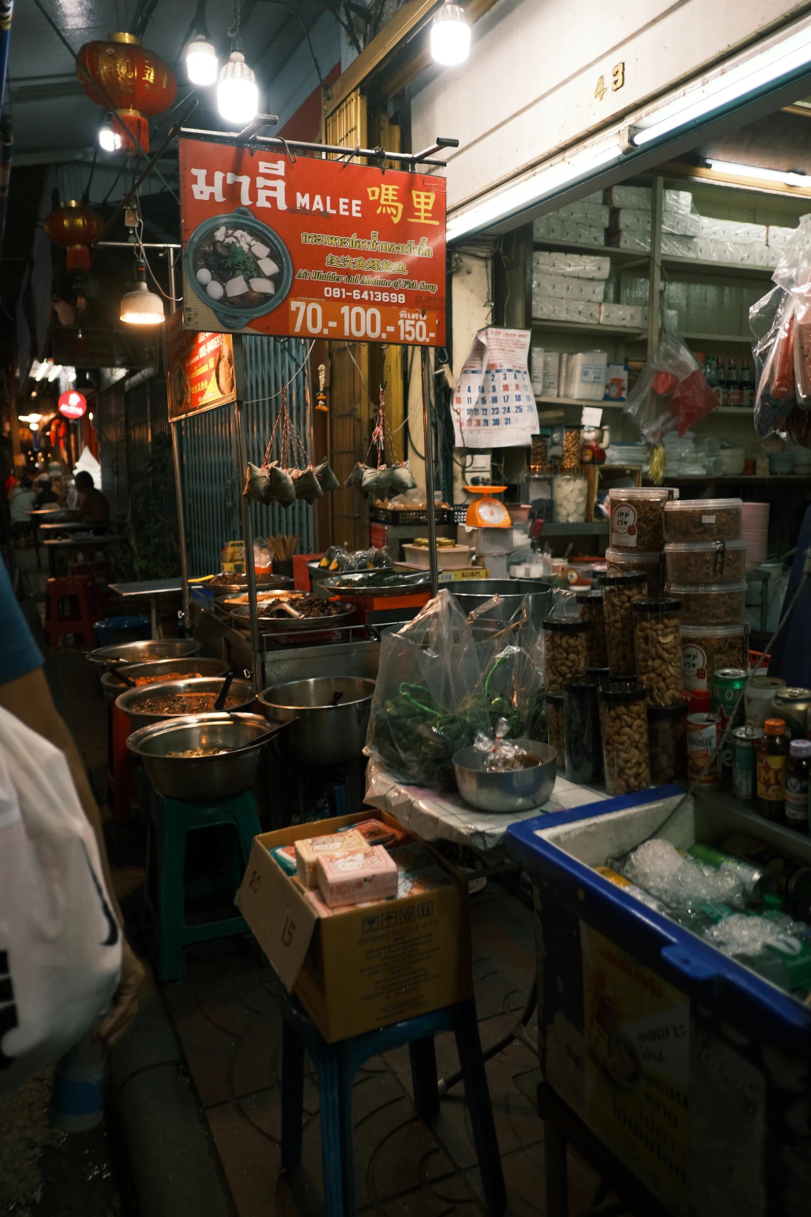 Street-food stall with prepared dishes and ingredients.