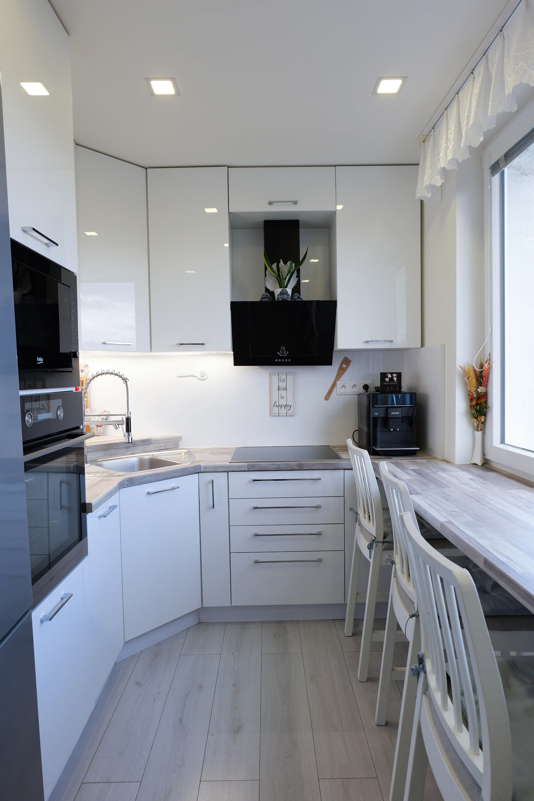 Bright modern kitchen with countertop appliances arranged for everyday cooking