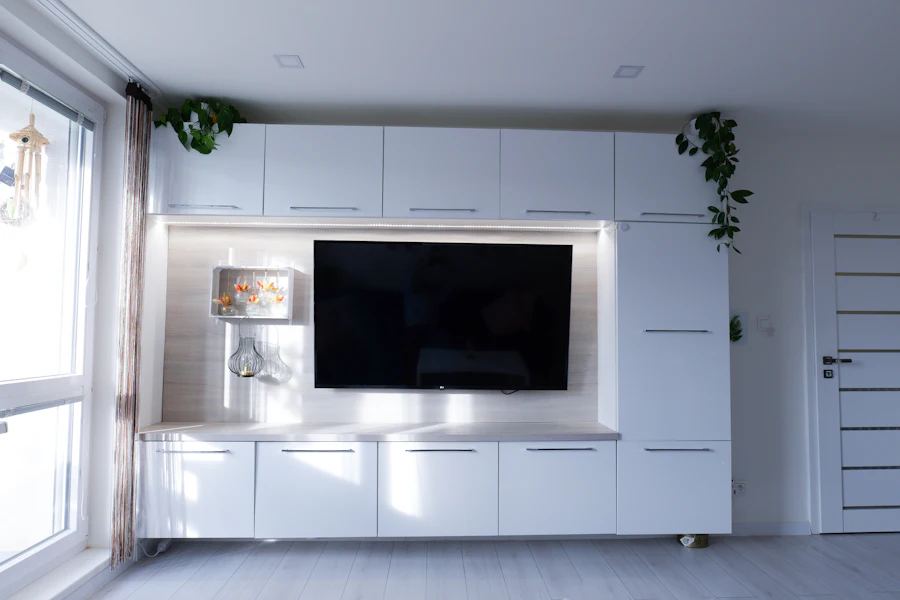 White built-in TV wall unit with an LED frame (inspiration)