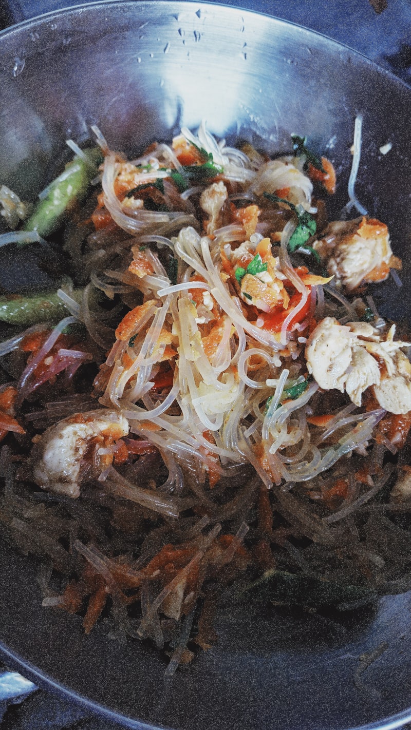 Glass noodle japchae tossed with colorful julienned vegetables
