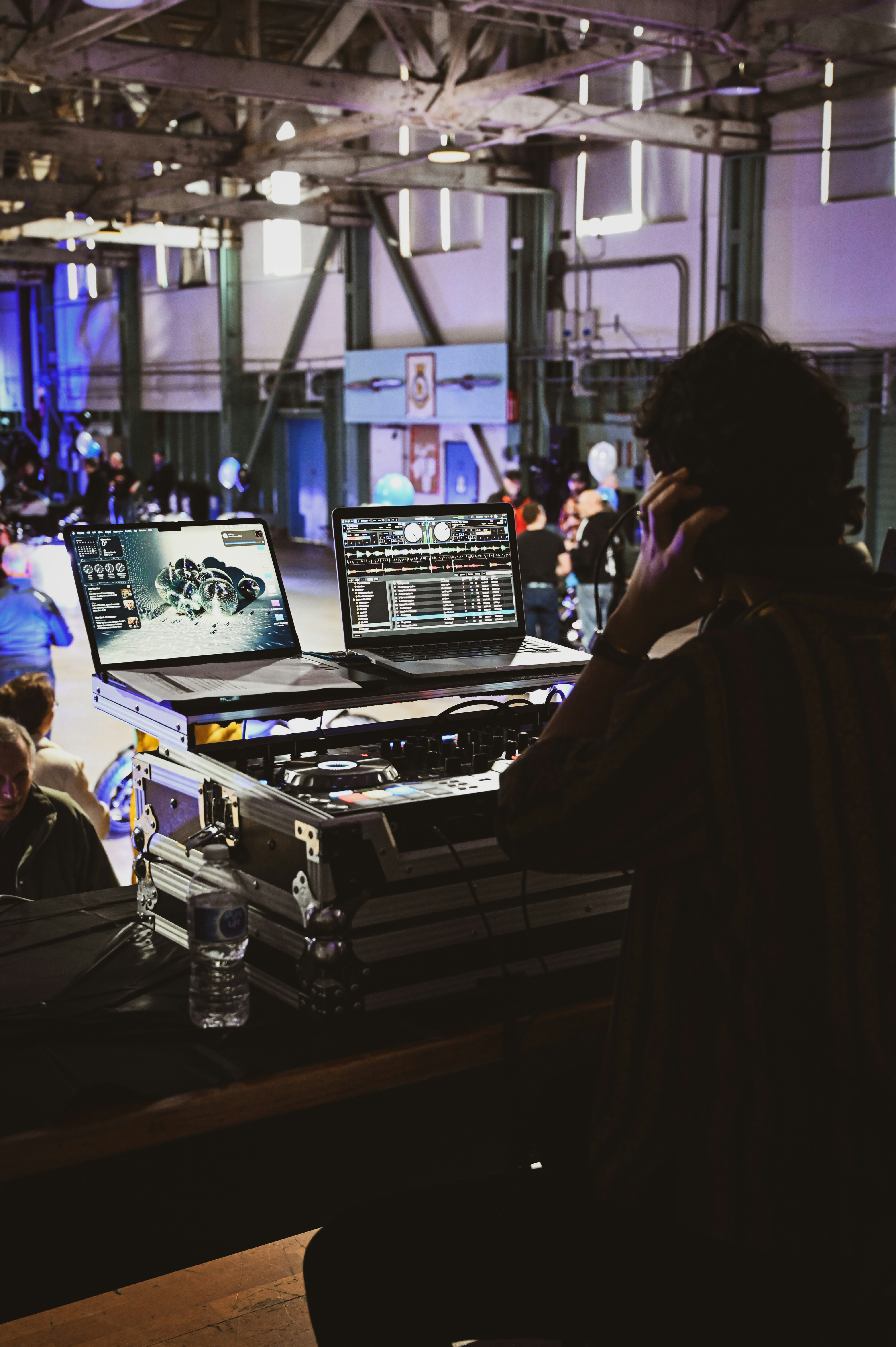 Dj with laptops and equipment at a concert
