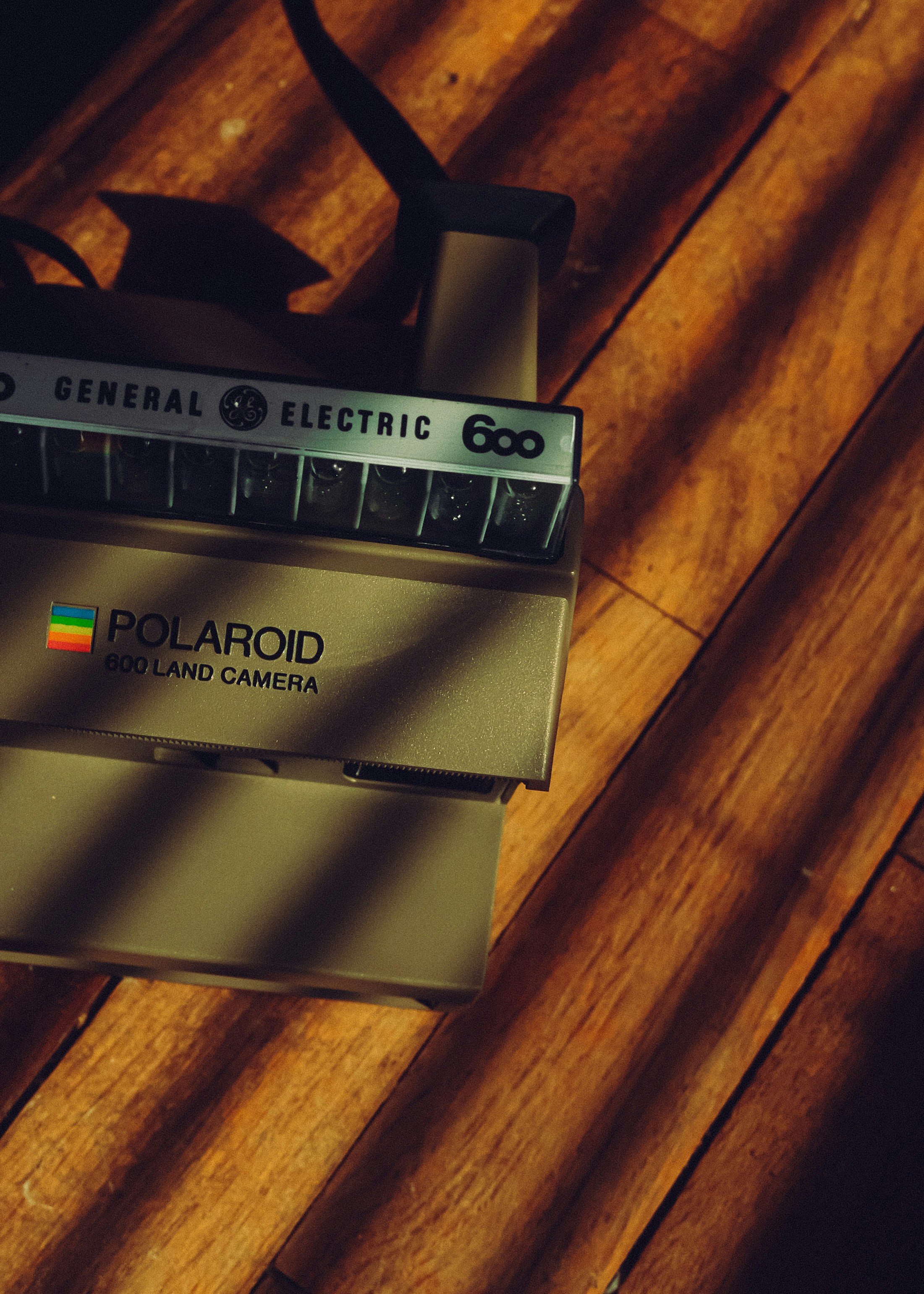 Vintage polaroid land camera on wooden floor