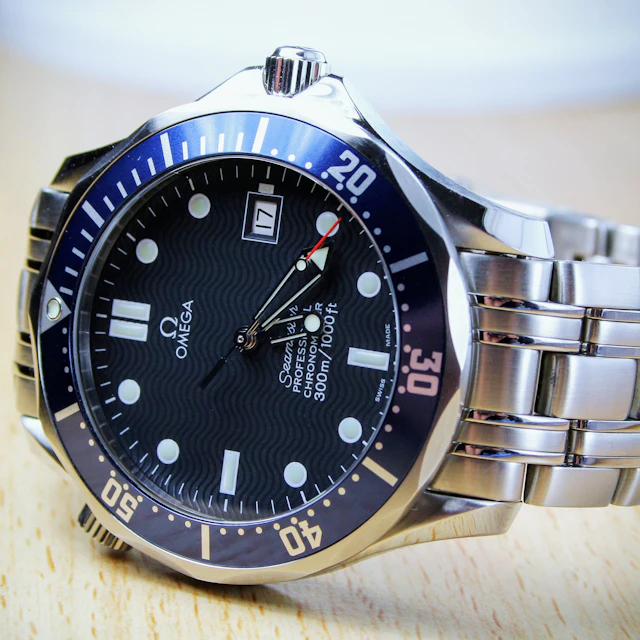 A close-up of a luxury stainless steel wristwatch