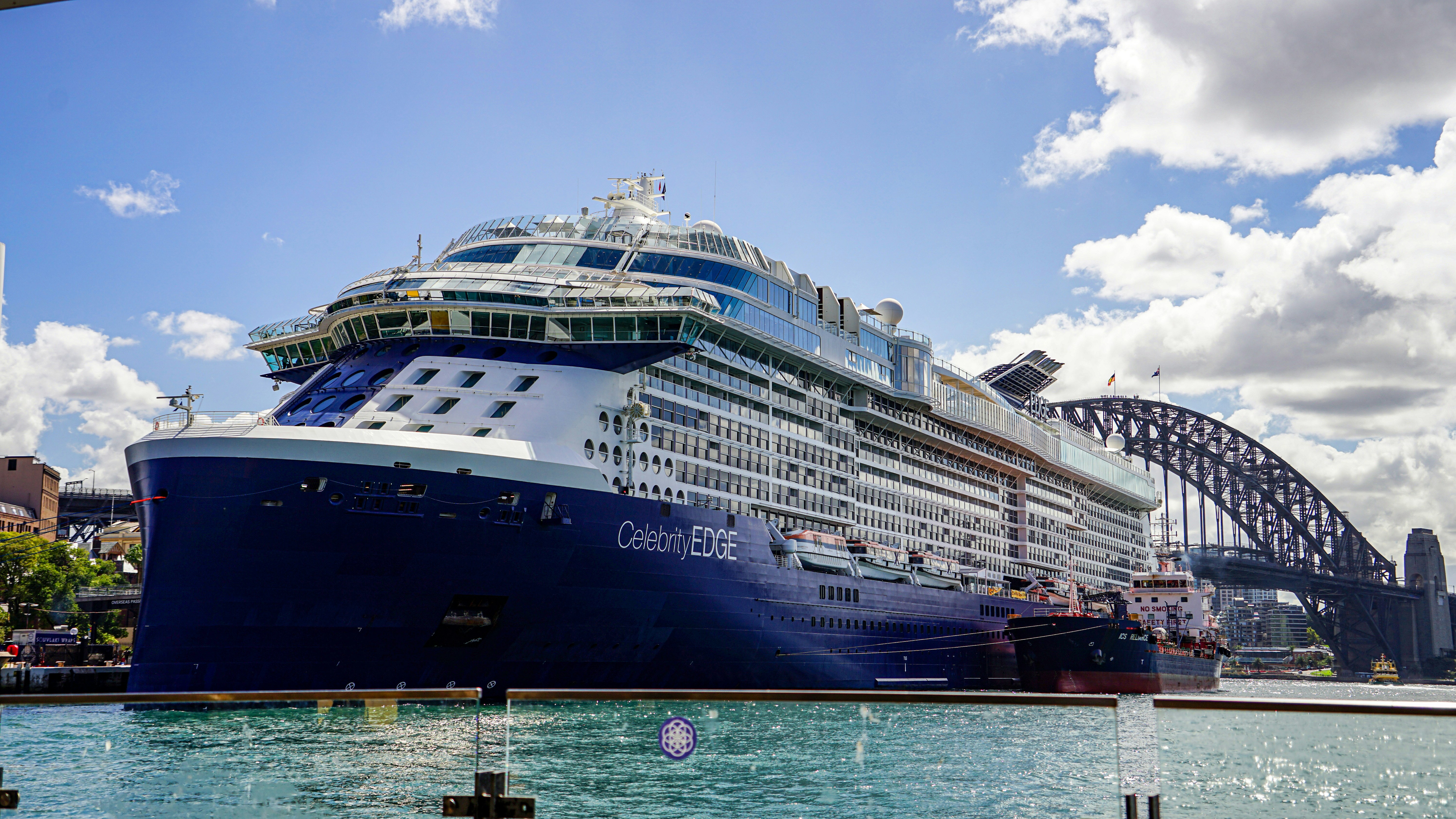Large cruise ship docked near sydney harbour bridge