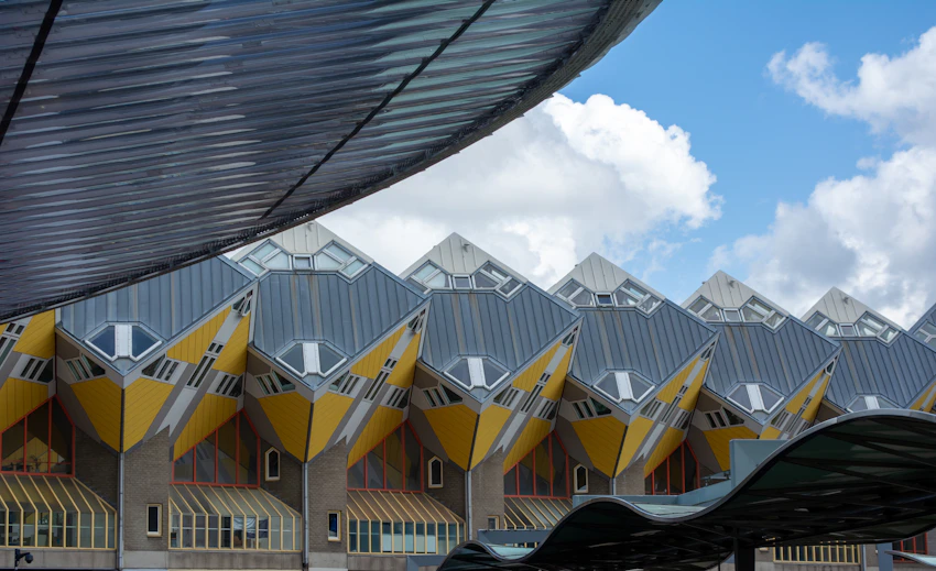 Rotterdam Cube Houses beneath a bright city sky