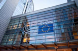 European union flag reflected on modern building glass