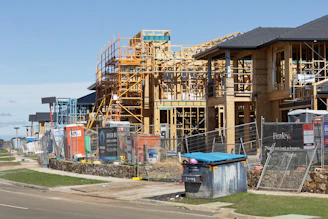New houses under construction with wooden frames.