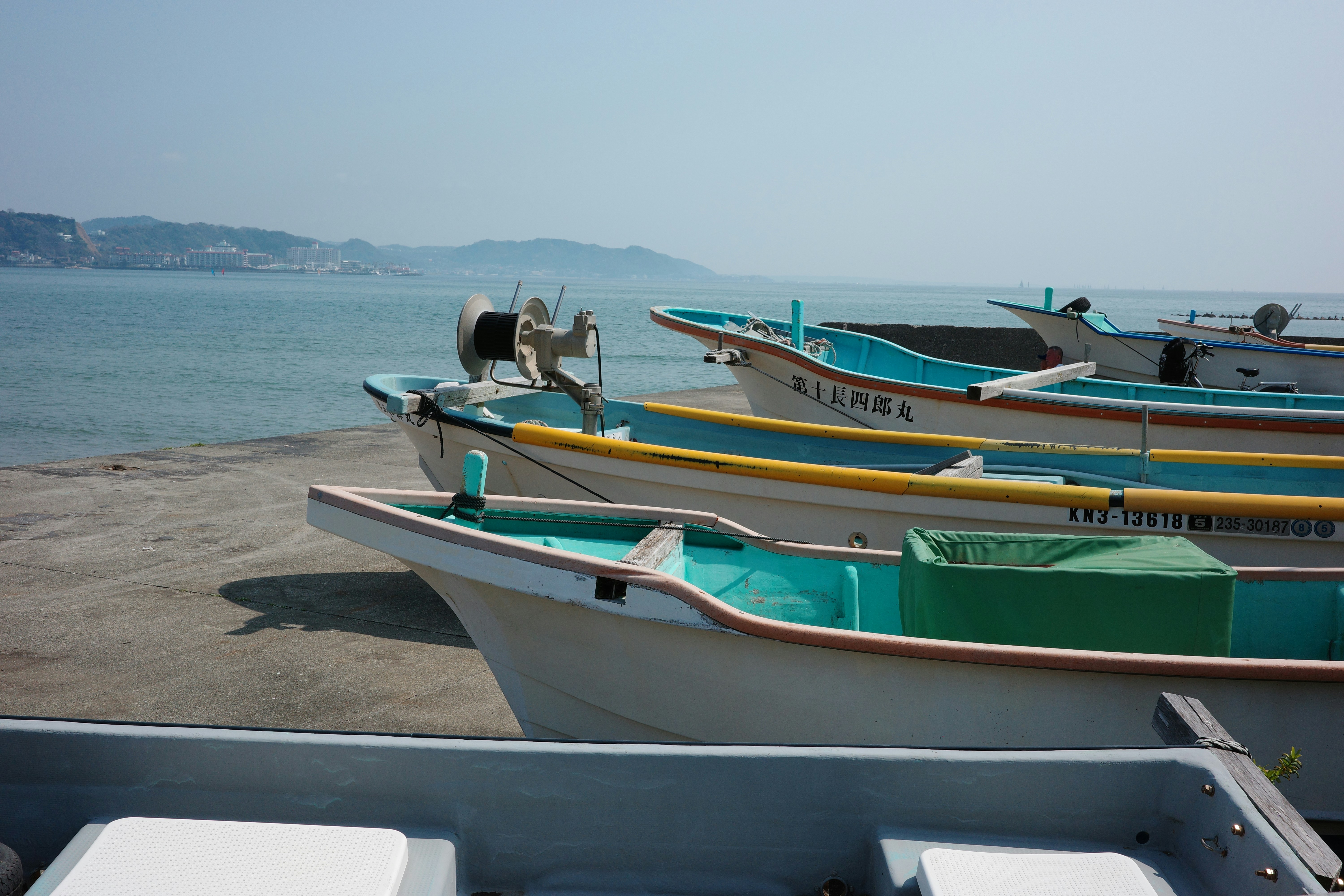 Fishing boats lined up on a sunny day